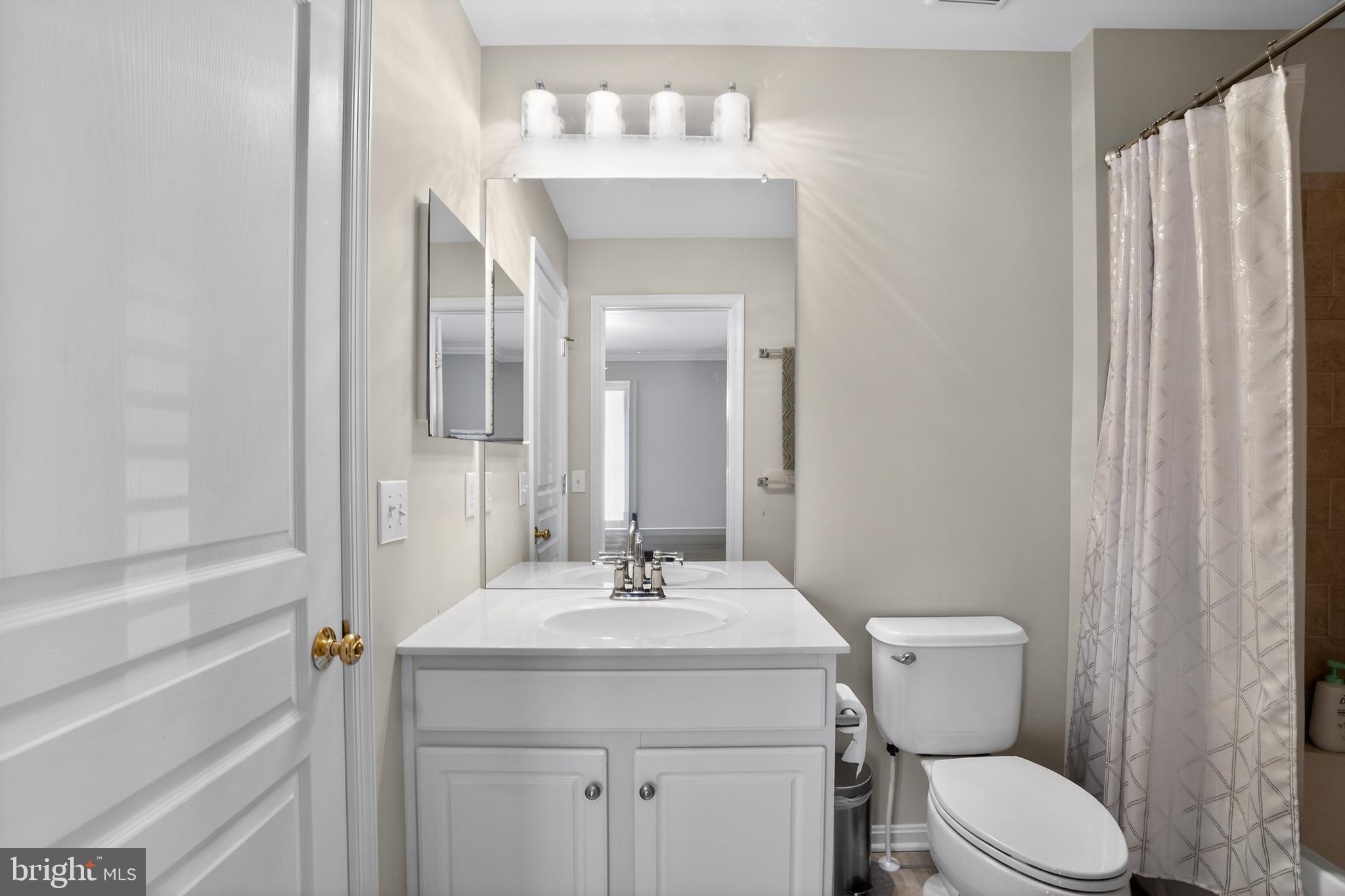 694 Churchill Road Chester Springs, PA 19425 - Photo 37 of 49 a bathroom with a sink a toilet and shower