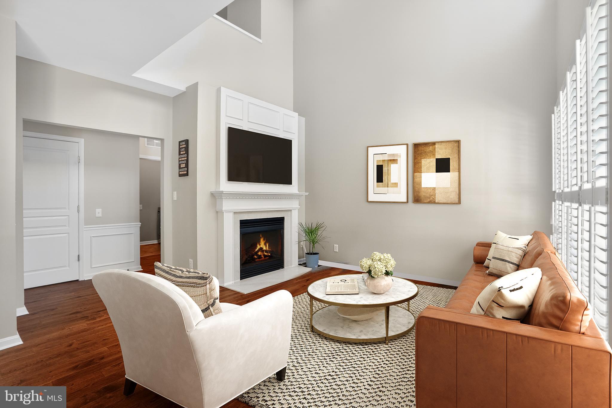 694 Churchill Road Chester Springs, PA 19425 - Photo 5 of 49 a living room with furniture a rug and a fireplace