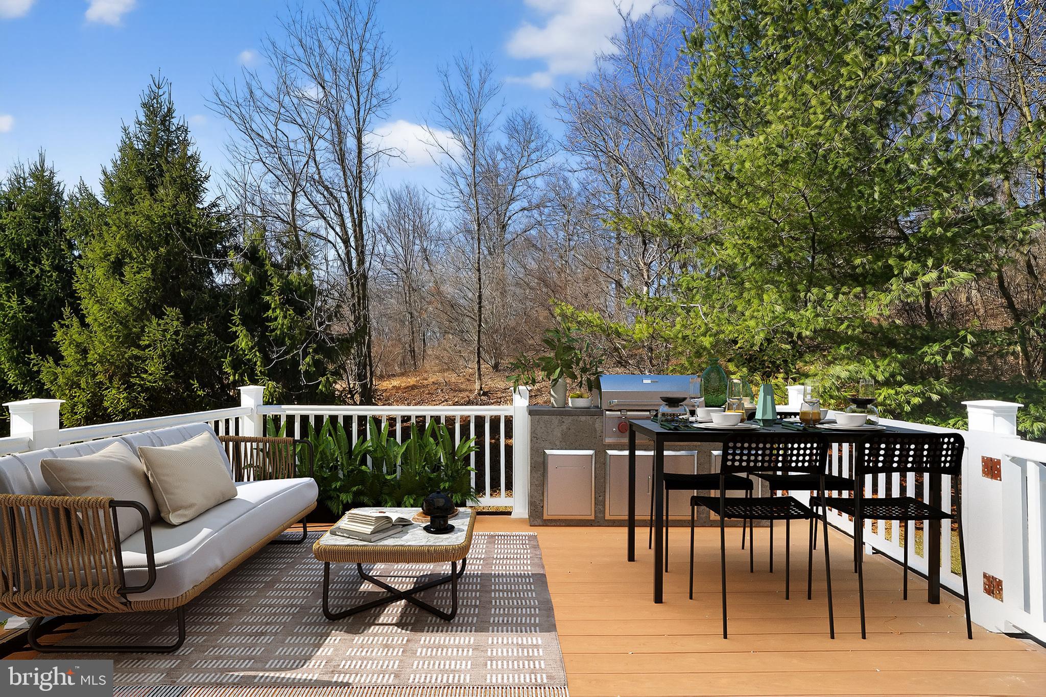 694 Churchill Road Chester Springs, PA 19425 - Photo 6 of 49 a view of a patio with a dining table and chairs