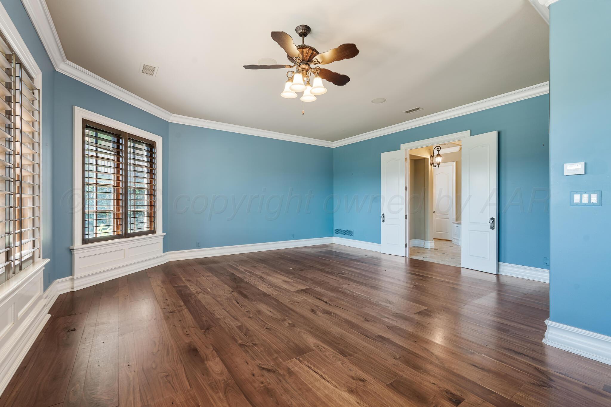 18 Cypress Point Amarillo, TX 79124 - Photo 50 of 95 a view of an empty room with wooden floor and a window