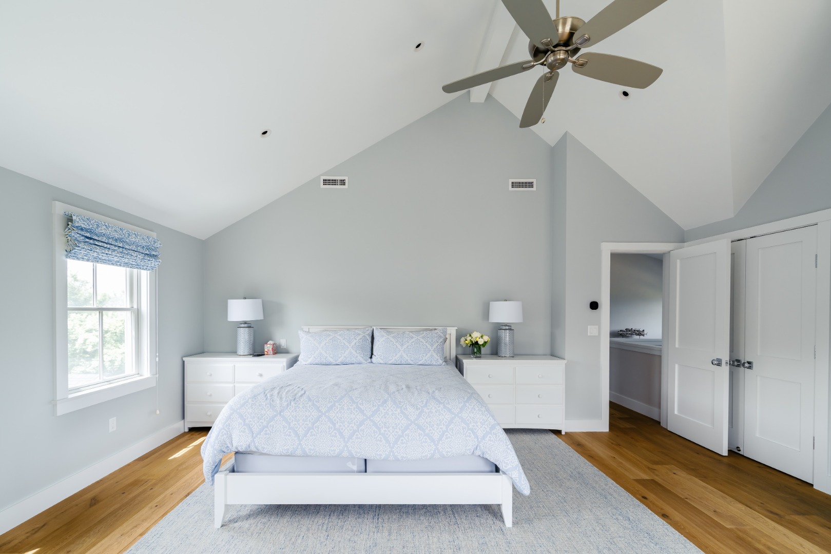 86 Cliff Road Nantucket, MA 02554 - Photo 14 of 29 a bedroom with a bed and a window