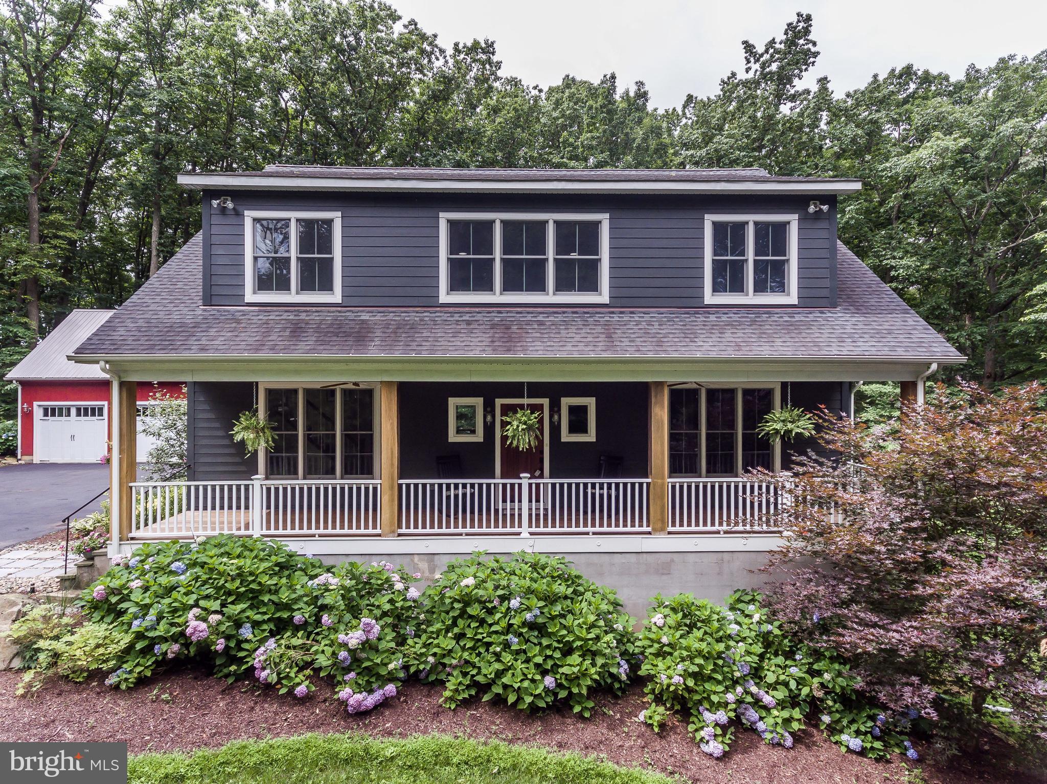 16526 Dubbs Road Sparks, MD 21152 - Photo 1 of 29 a house with a garden view
