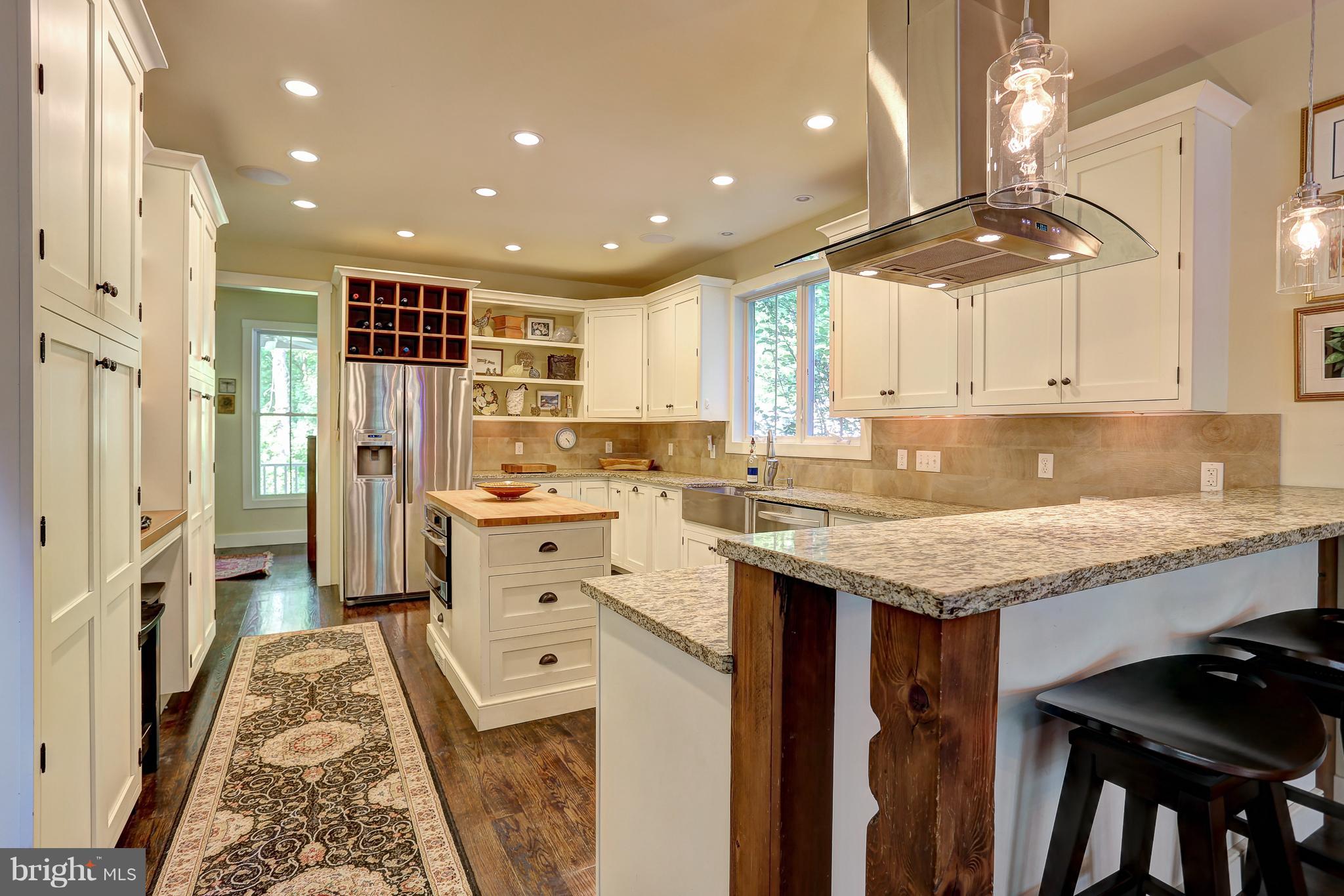 16526 Dubbs Road Sparks, MD 21152 - Photo 13 of 29 a kitchen with stainless steel appliances granite countertop a lot of counter space and a sink