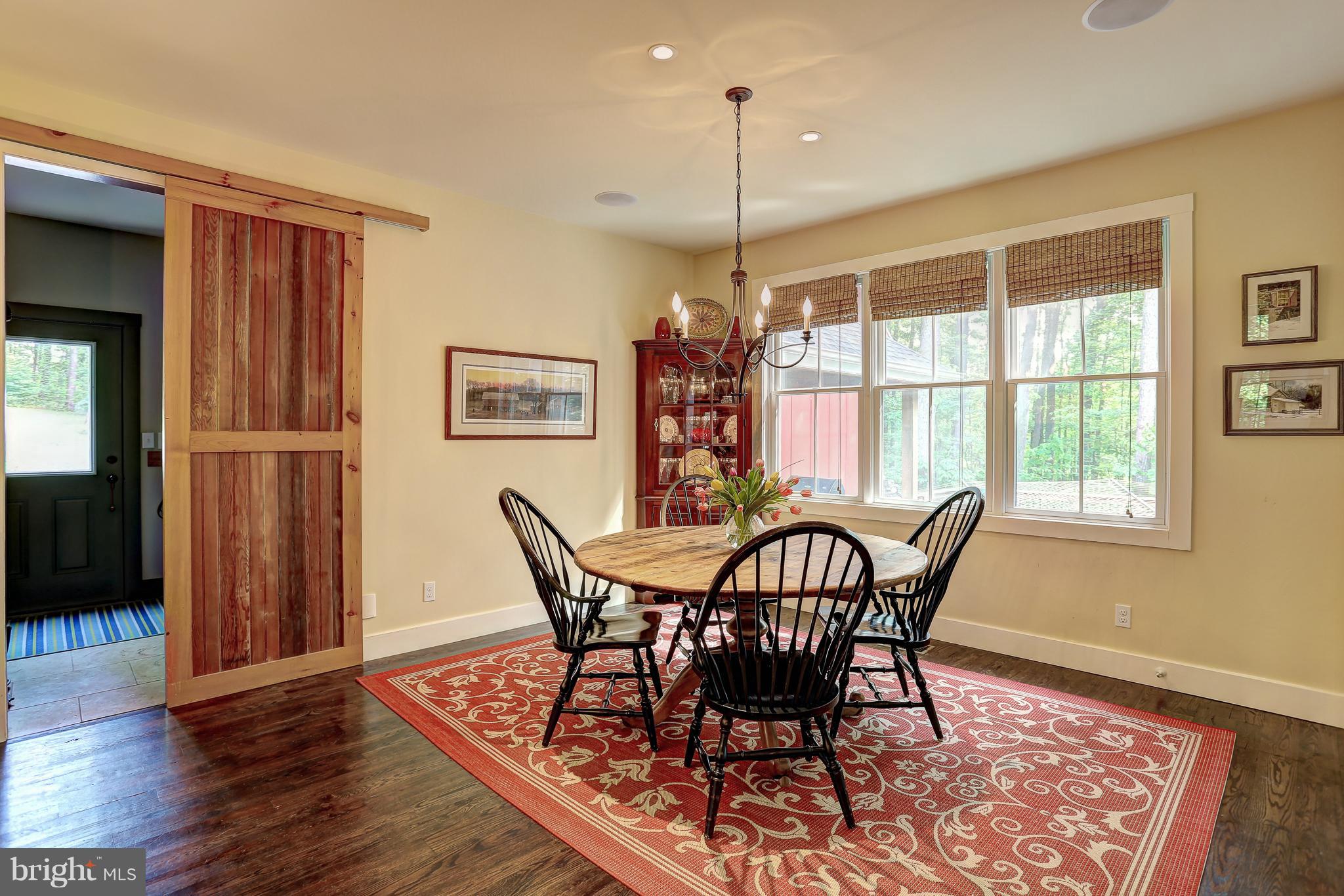 16526 Dubbs Road Sparks, MD 21152 - Photo 14 of 29 a view of a dining room with furniture window and wooden floor