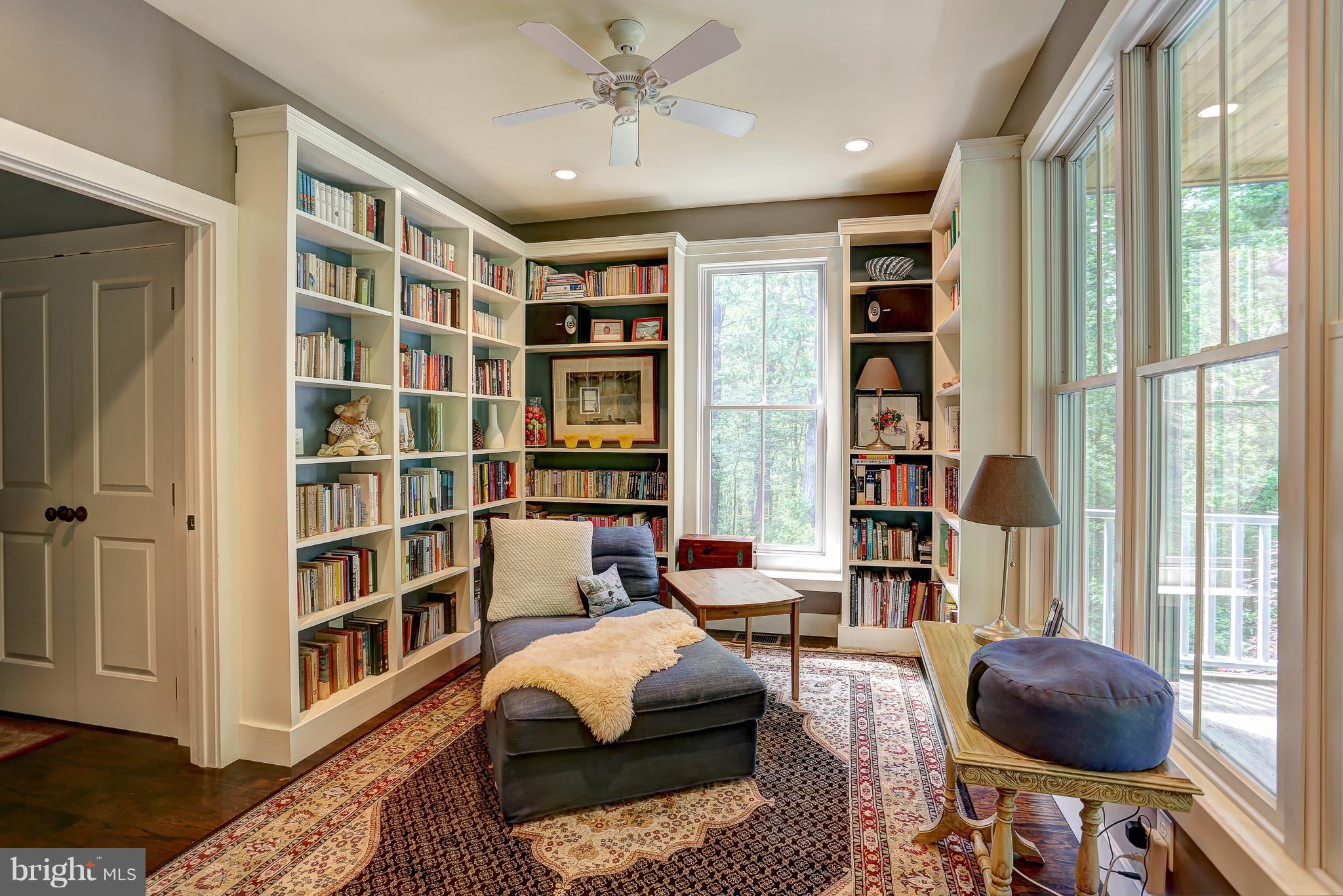 16526 Dubbs Road Sparks, MD 21152 - Photo 15 of 29 a living room with furniture and a book shelf