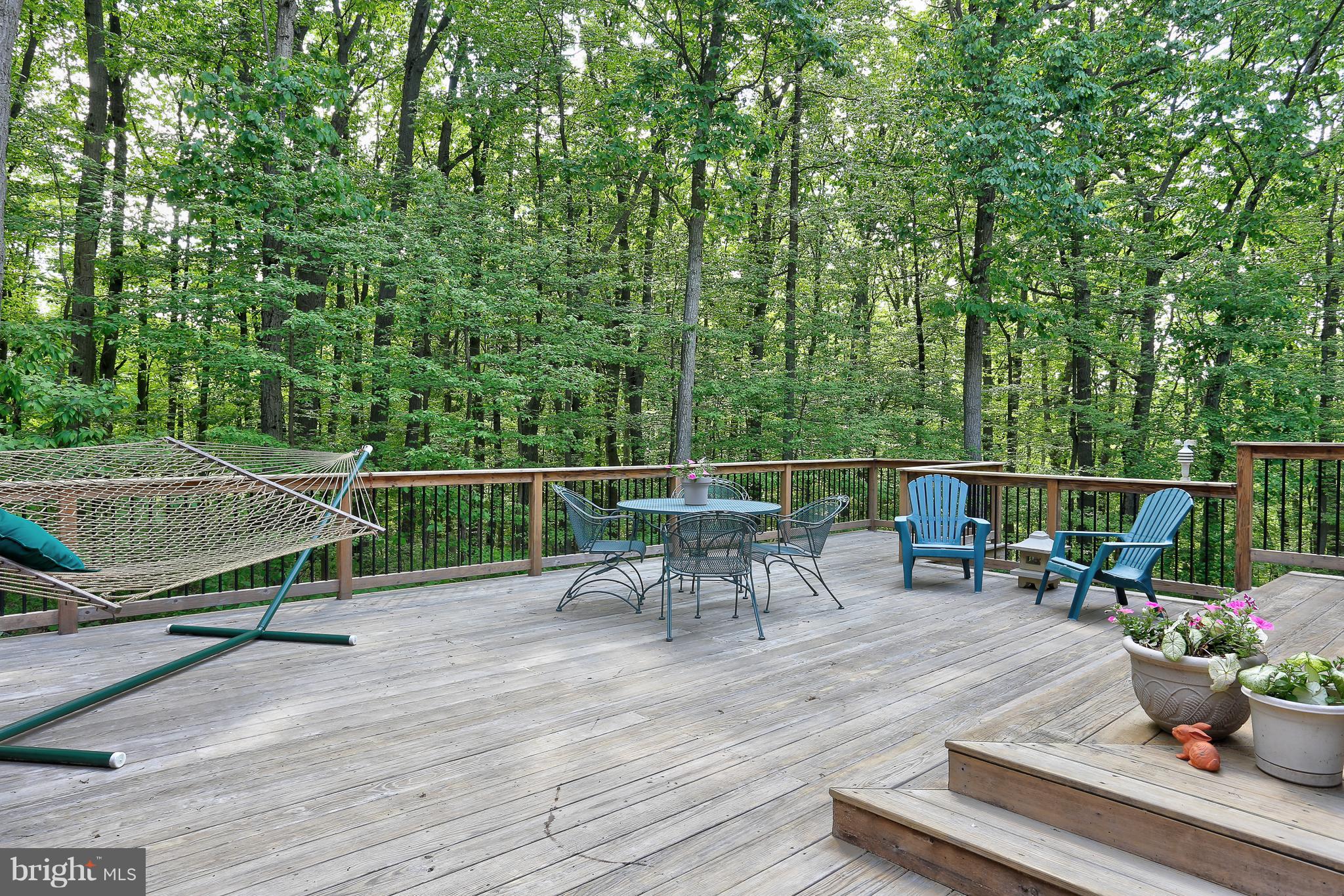 16526 Dubbs Road Sparks, MD 21152 - Photo 24 of 29 a view of a chairs and table on the wooden deck
