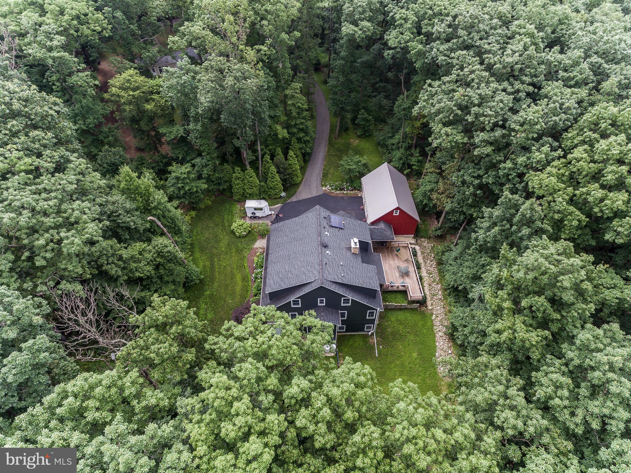 16526 Dubbs Road Sparks, MD 21152 - Photo 29 of 29 an aerial view of a house with a yard and large trees