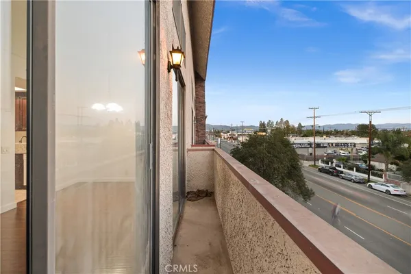 a view of a balcony with city view