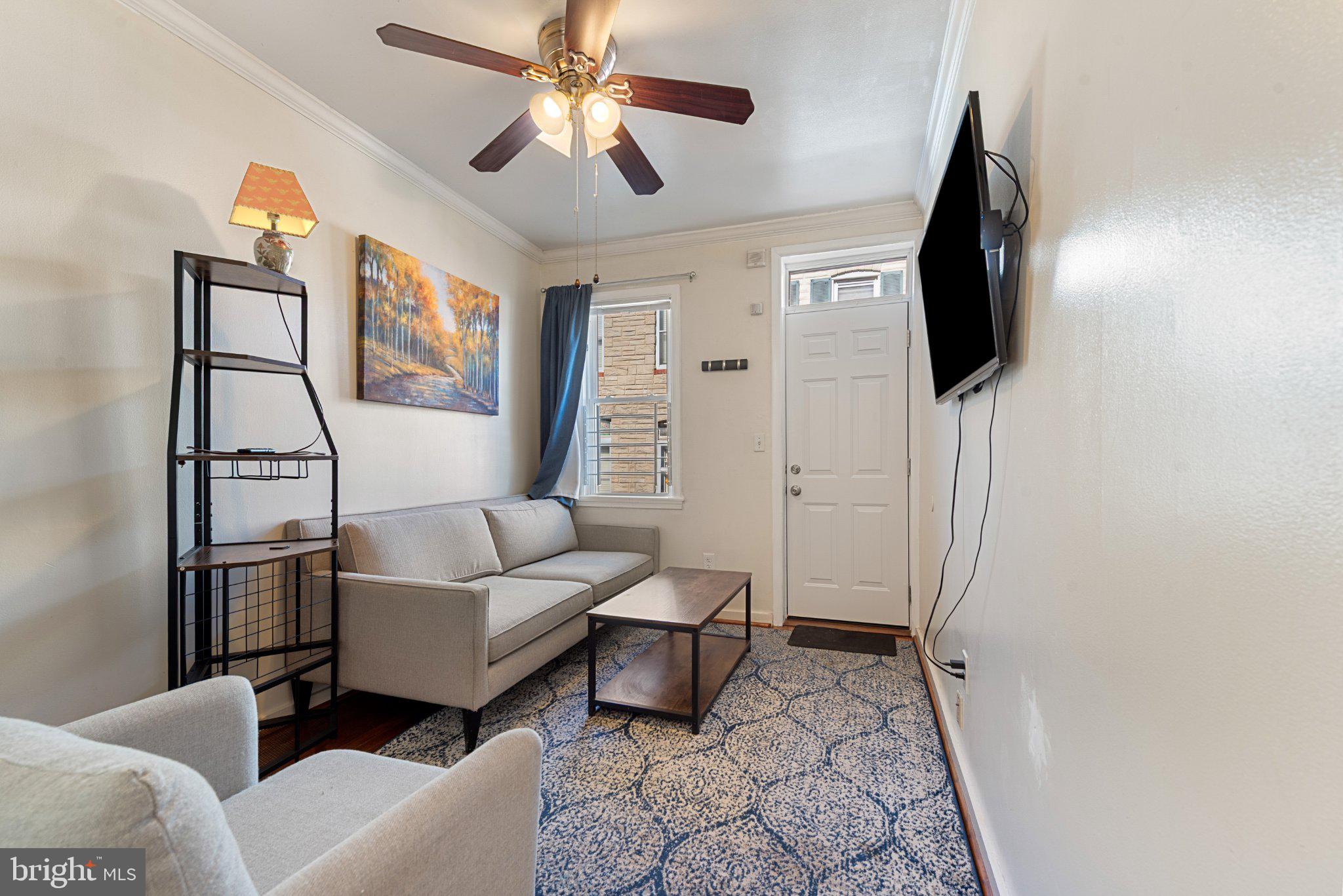 211 South Madeira Street Baltimore, MD 21231 - Photo 6 of 18 Cozy living space with modern charm.