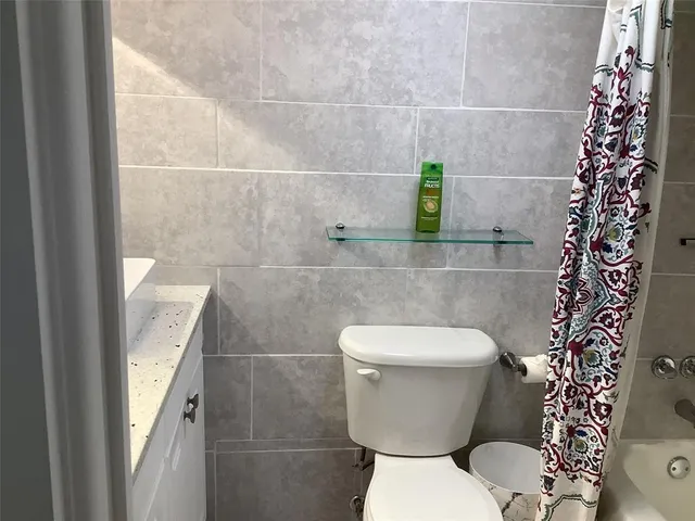 a bathroom with a toilet and a sink