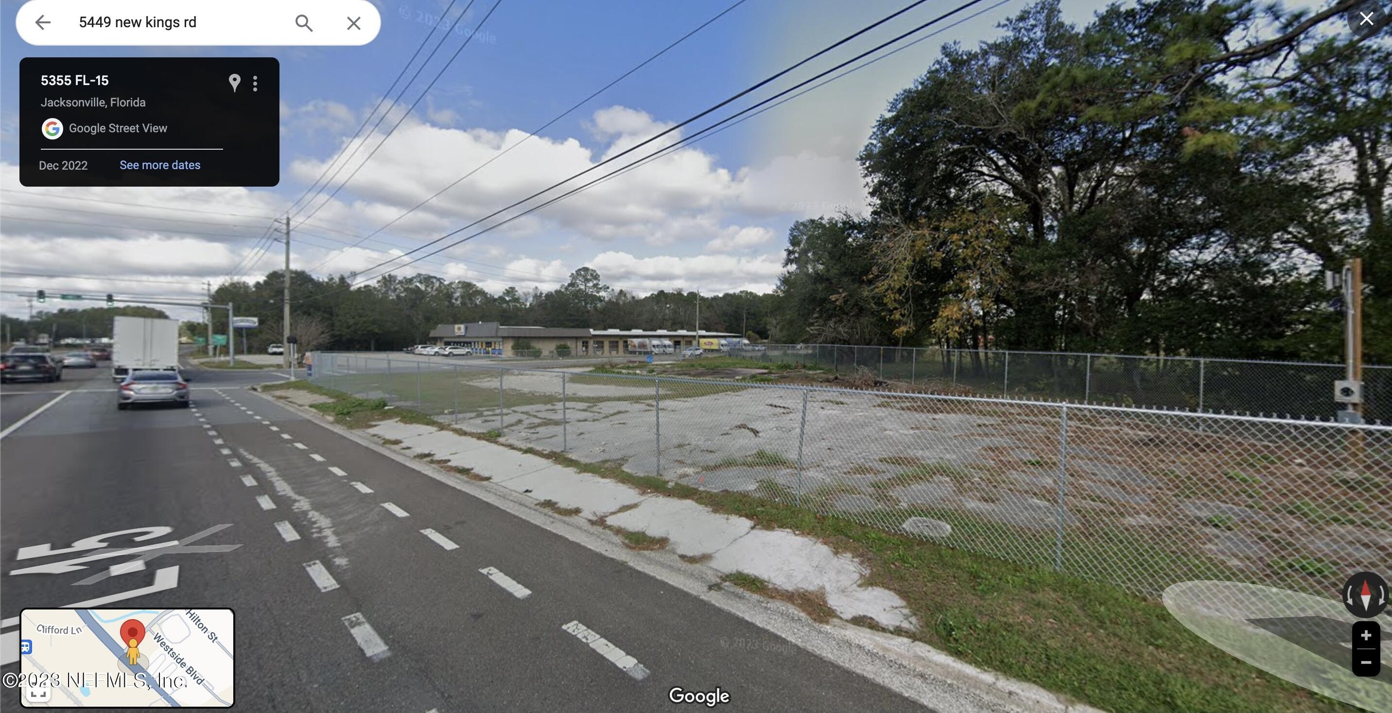 5449 New Kings Road Jacksonville, FL 32209 - Photo 2 of 8 a view of a street with a cars parked