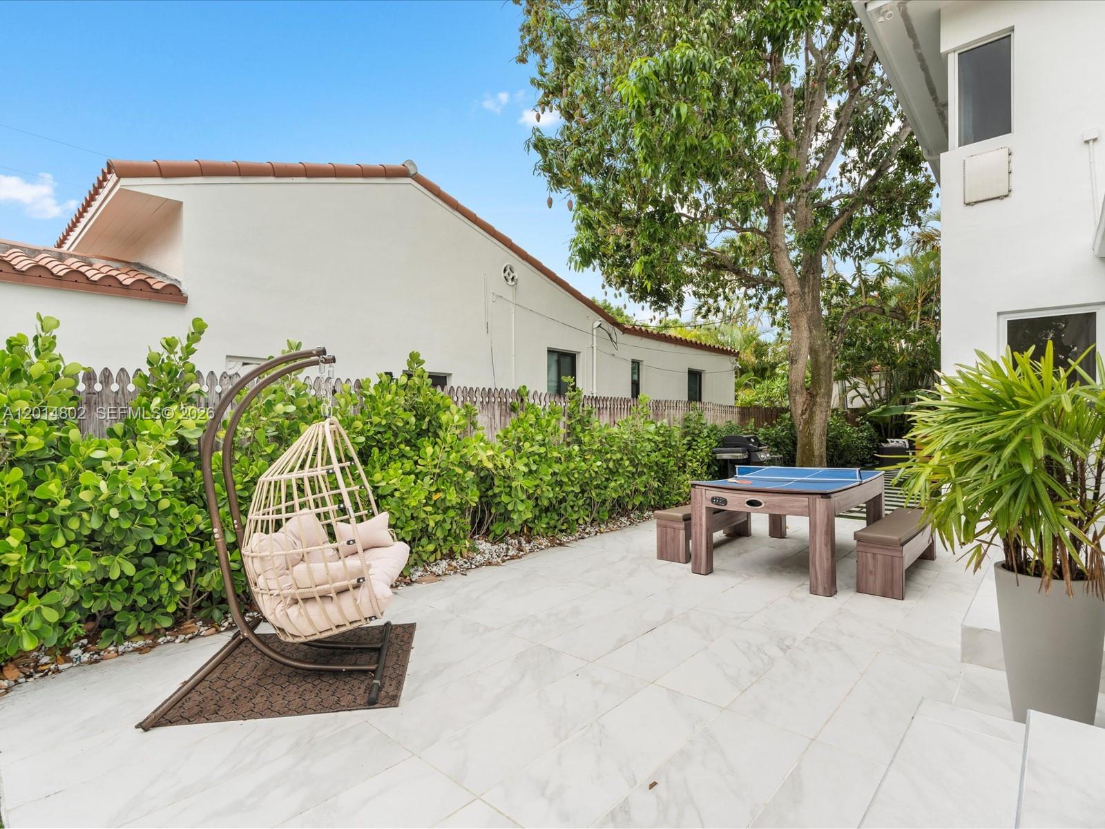 825 Southwest 23rd Road, Unit 1 Miami, FL 33129 - Photo 12 of 92 a view of a backyard with sitting area
