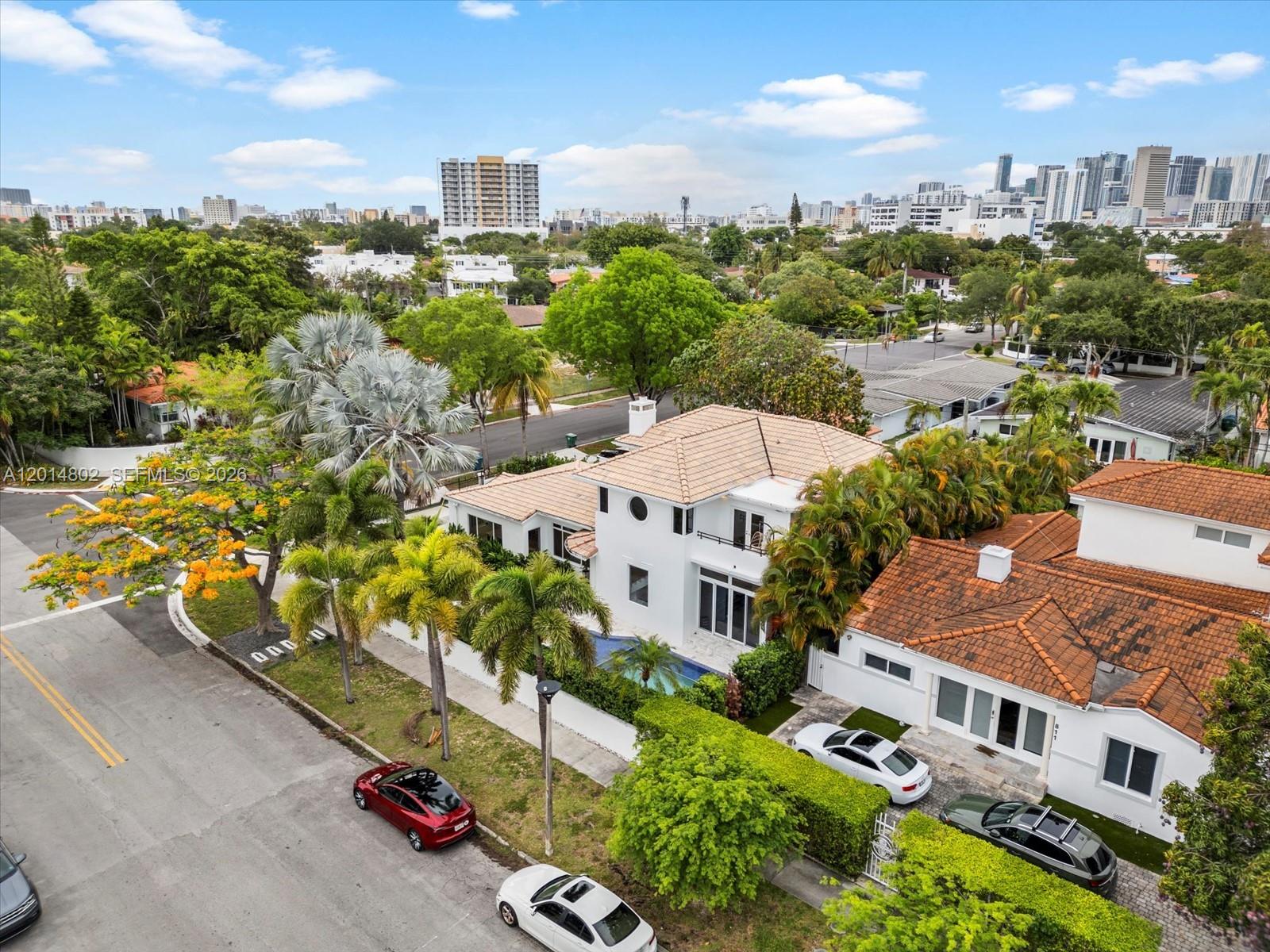 825 Southwest 23rd Road, Unit 1 Miami, FL 33129 - Photo 21 of 92 an aerial view of multiple houses with a yard