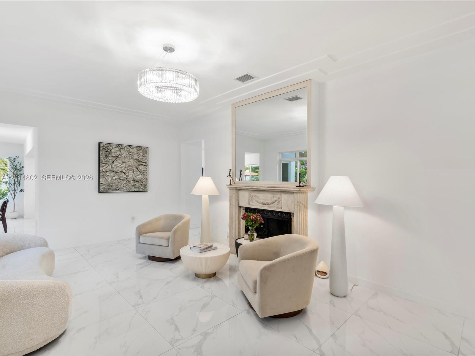825 Southwest 23rd Road, Unit 1 Miami, FL 33129 - Photo 37 of 92 a living room with furniture and a fireplace