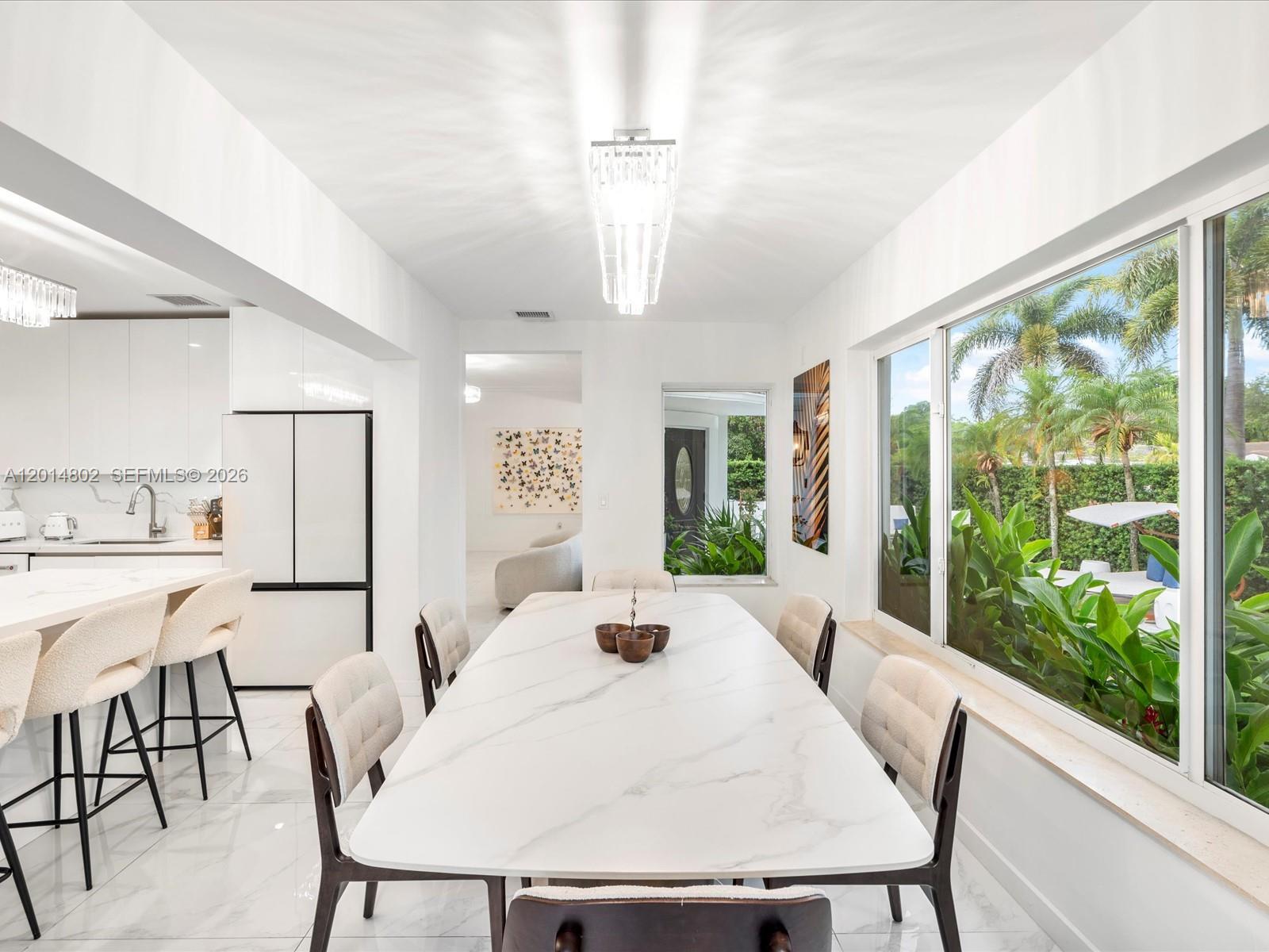 825 Southwest 23rd Road, Unit 1 Miami, FL 33129 - Photo 43 of 92 a large white kitchen with a large window