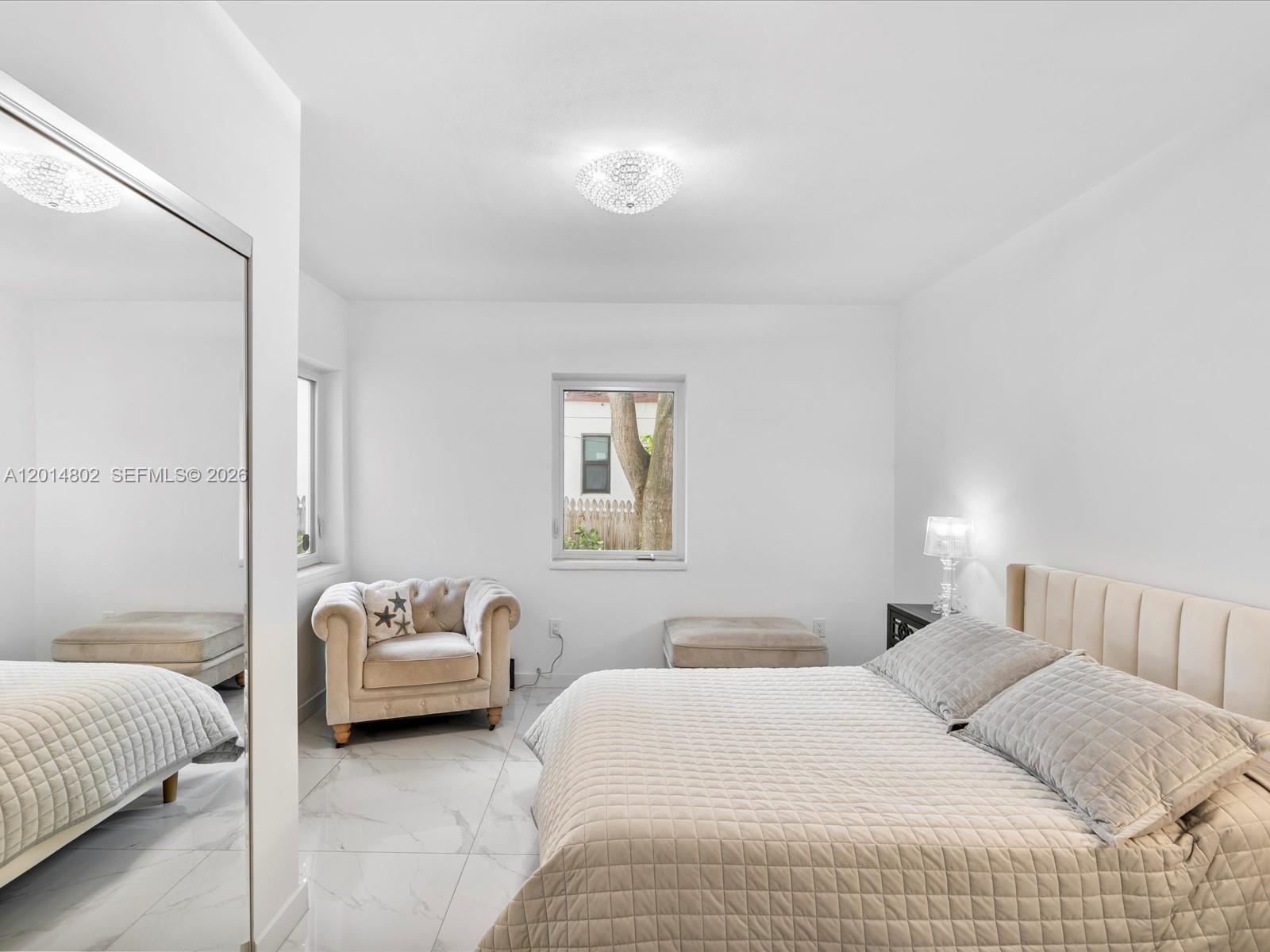 825 Southwest 23rd Road, Unit 1 Miami, FL 33129 - Photo 56 of 92 a bedroom with a bed and a couch