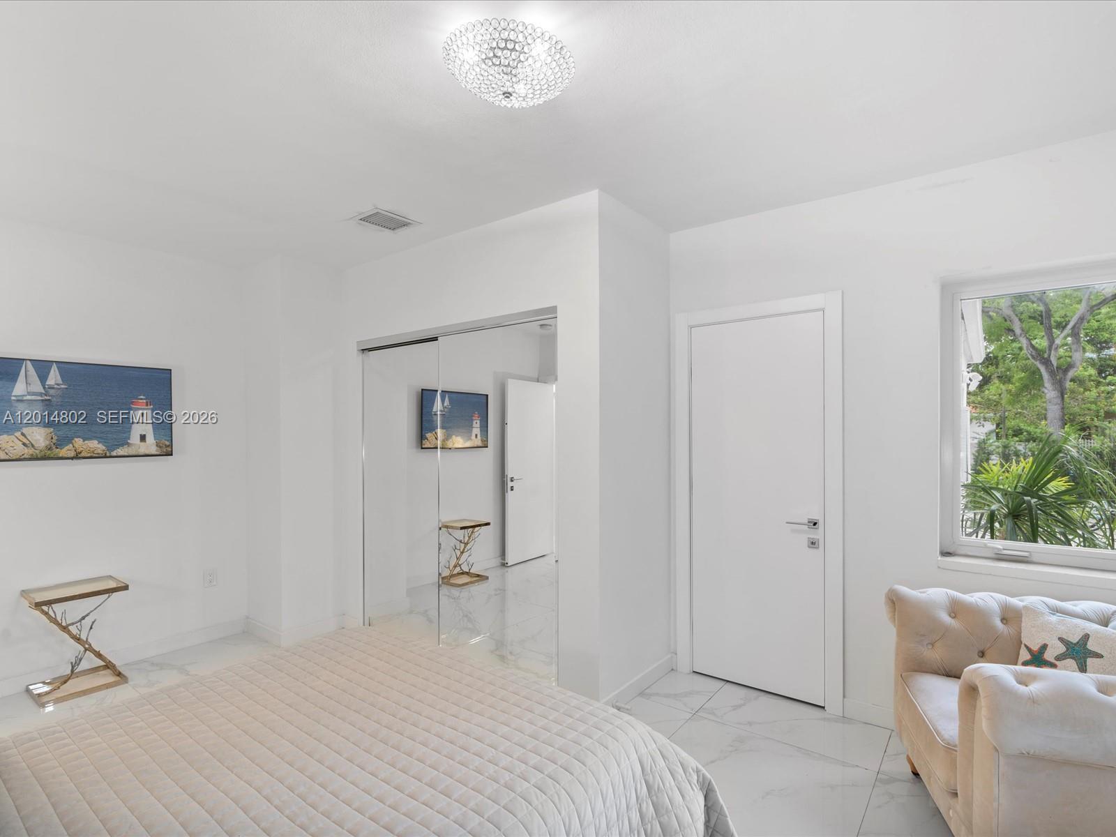 825 Southwest 23rd Road, Unit 1 Miami, FL 33129 - Photo 57 of 92 a bedroom with a bed and a window