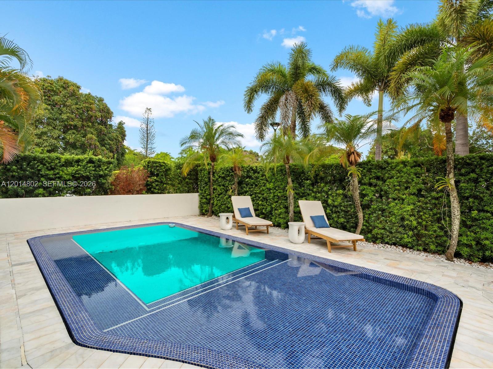 825 Southwest 23rd Road, Unit 1 Miami, FL 33129 - Photo 6 of 92 a view of a swimming pool with a patio