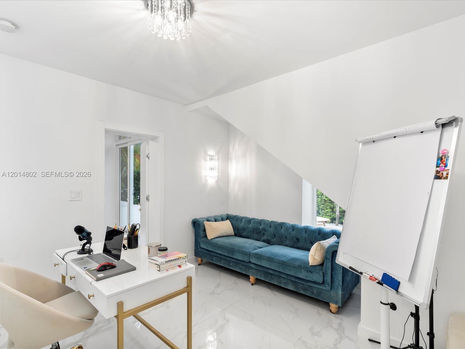 825 Southwest 23rd Road, Unit 1 Miami, FL 33129 - Photo 63 of 92 a living room with furniture and a table
