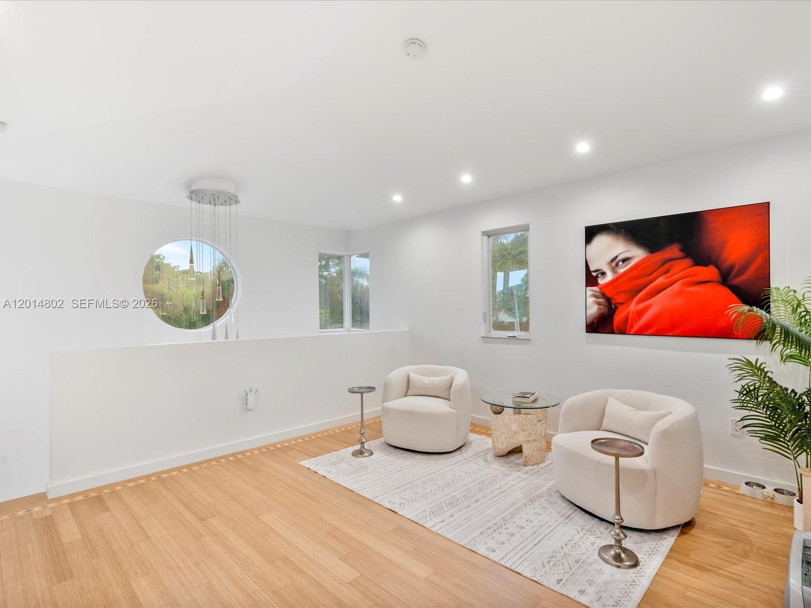 825 Southwest 23rd Road, Unit 1 Miami, FL 33129 - Photo 76 of 92 a living room with furniture and a mirror