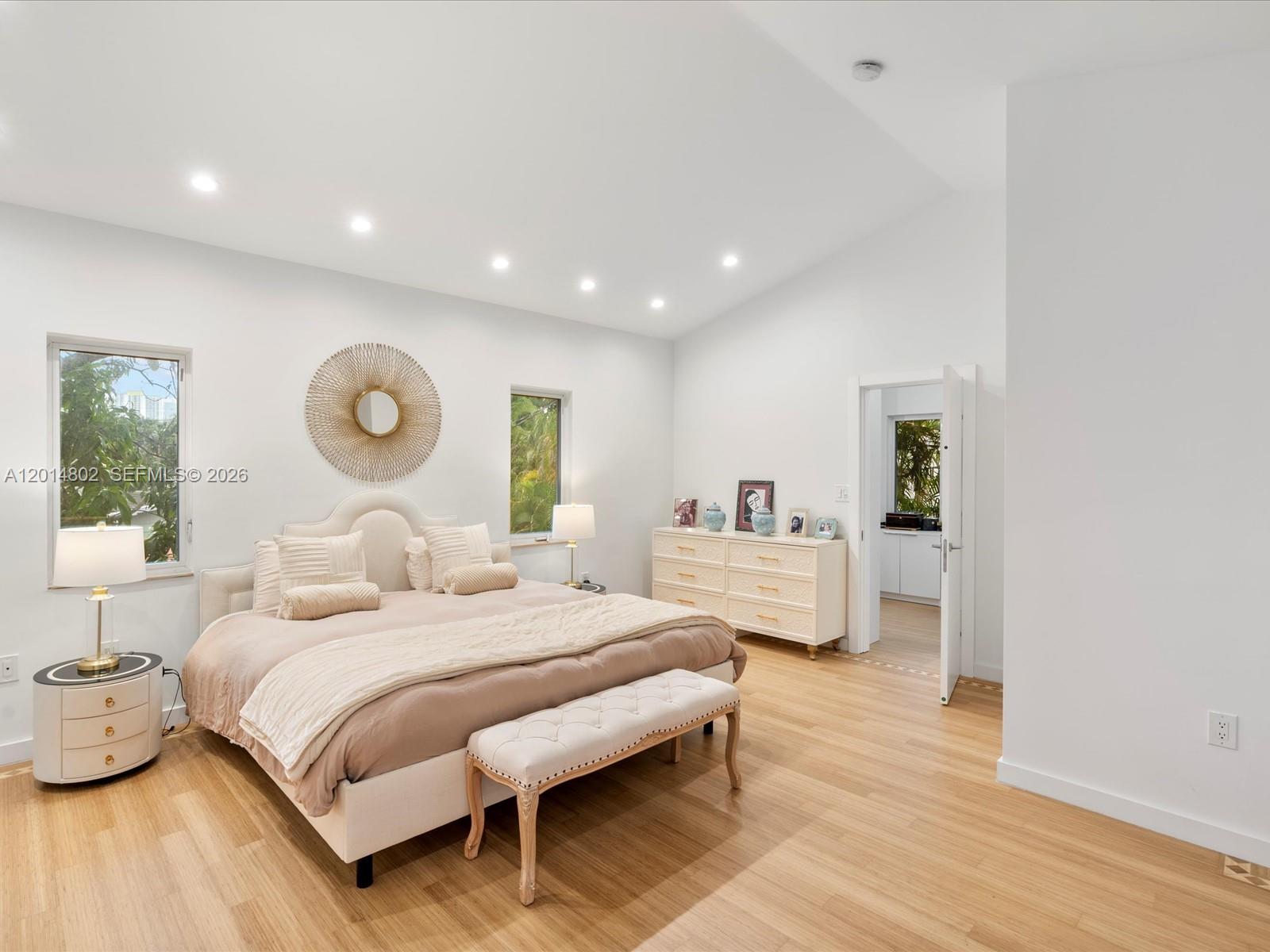 825 Southwest 23rd Road, Unit 1 Miami, FL 33129 - Photo 79 of 92 a bedroom with a large bed and wooden floor