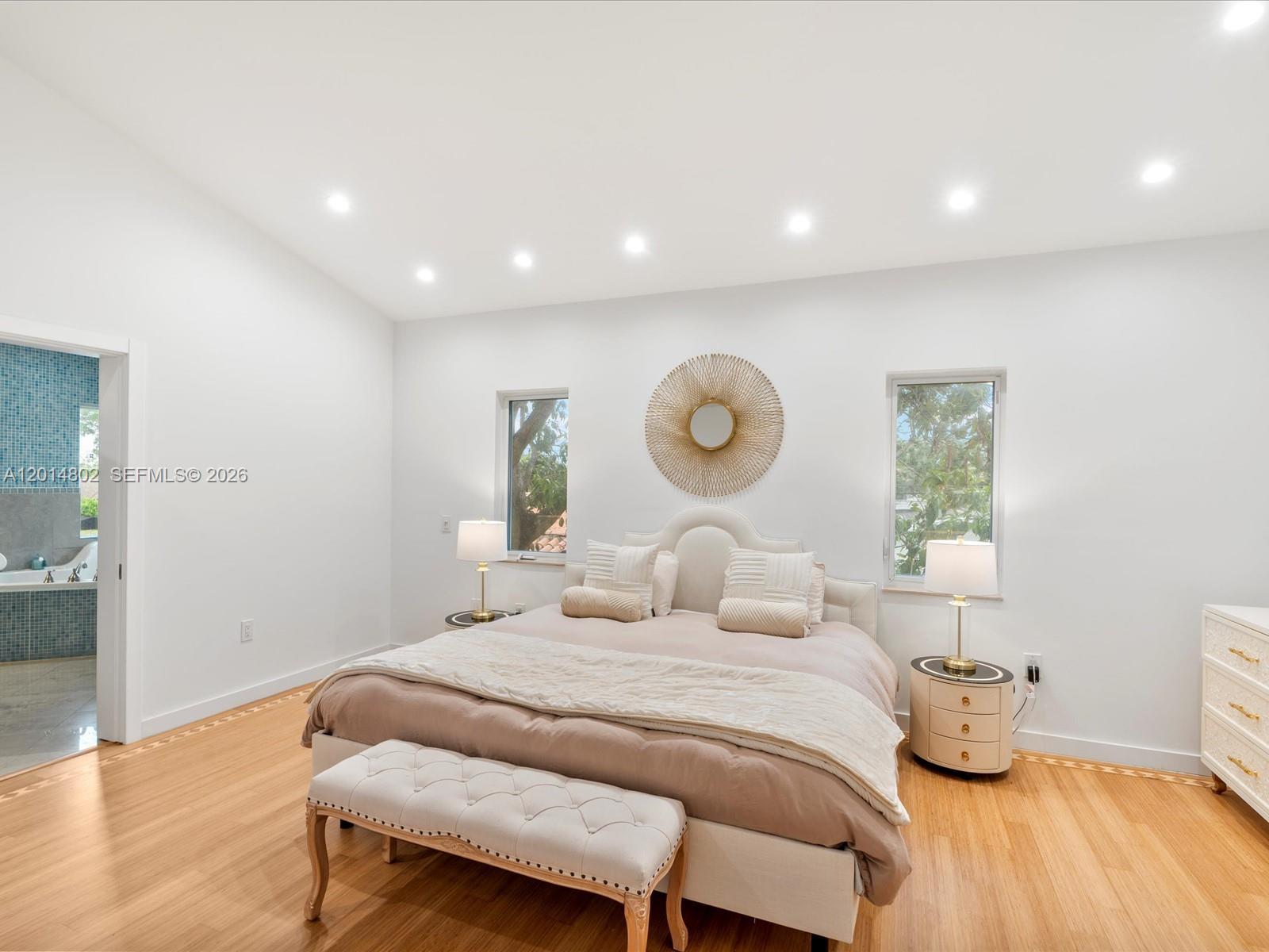825 Southwest 23rd Road, Unit 1 Miami, FL 33129 - Photo 80 of 92 a bedroom with a bed and wooden floor