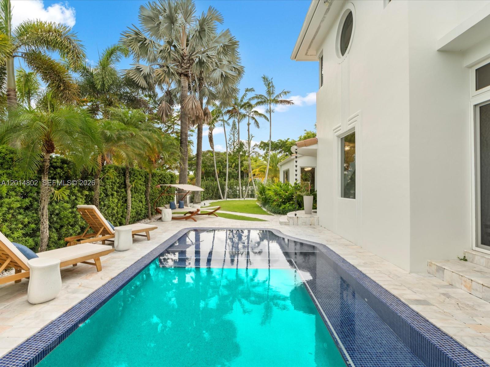 825 Southwest 23rd Road, Unit 1 Miami, FL 33129 - Photo 8 of 92 a view of a swimming pool with a patio