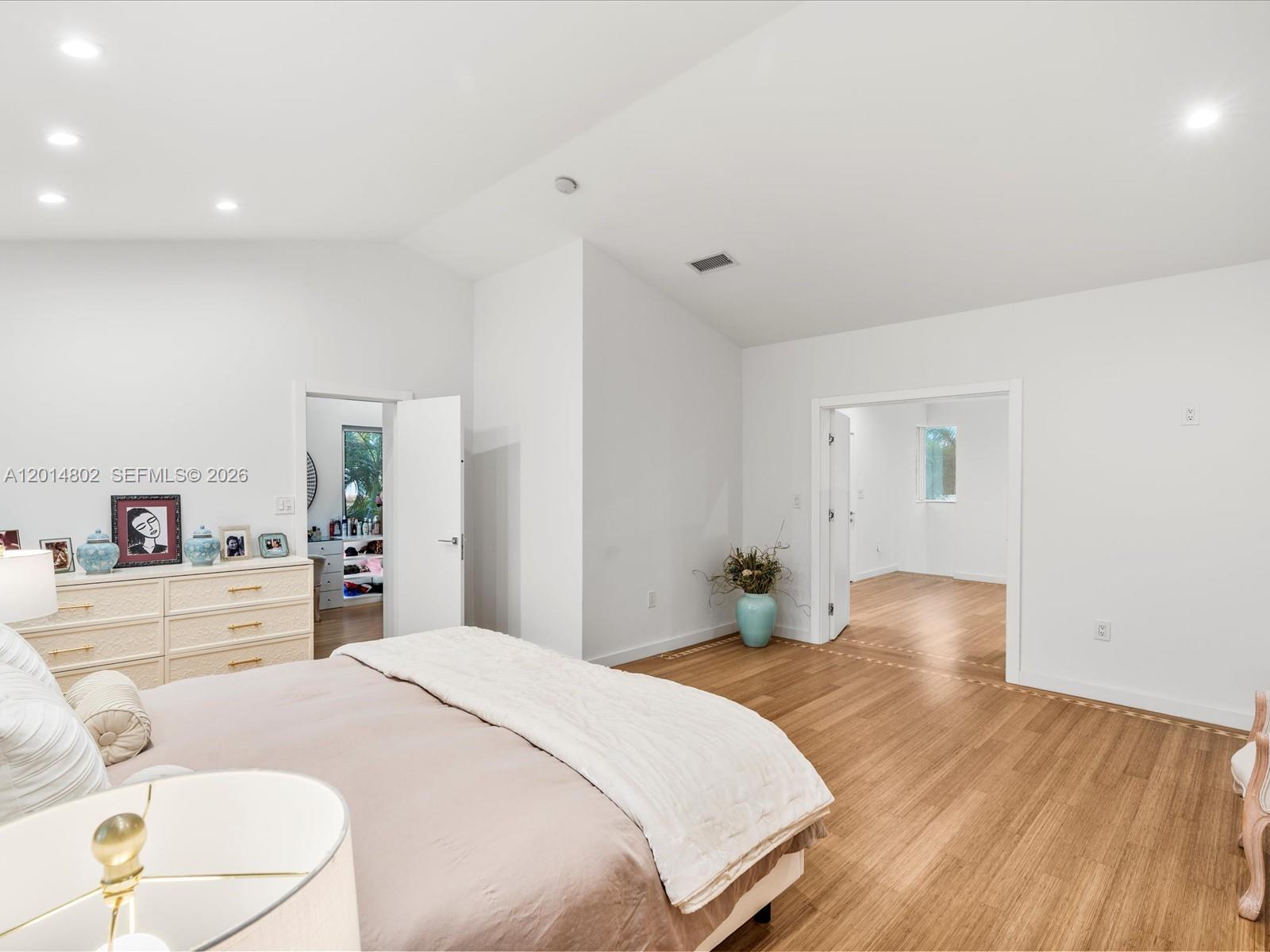 825 Southwest 23rd Road, Unit 1 Miami, FL 33129 - Photo 81 of 92 a bedroom with a bed and a large mirror