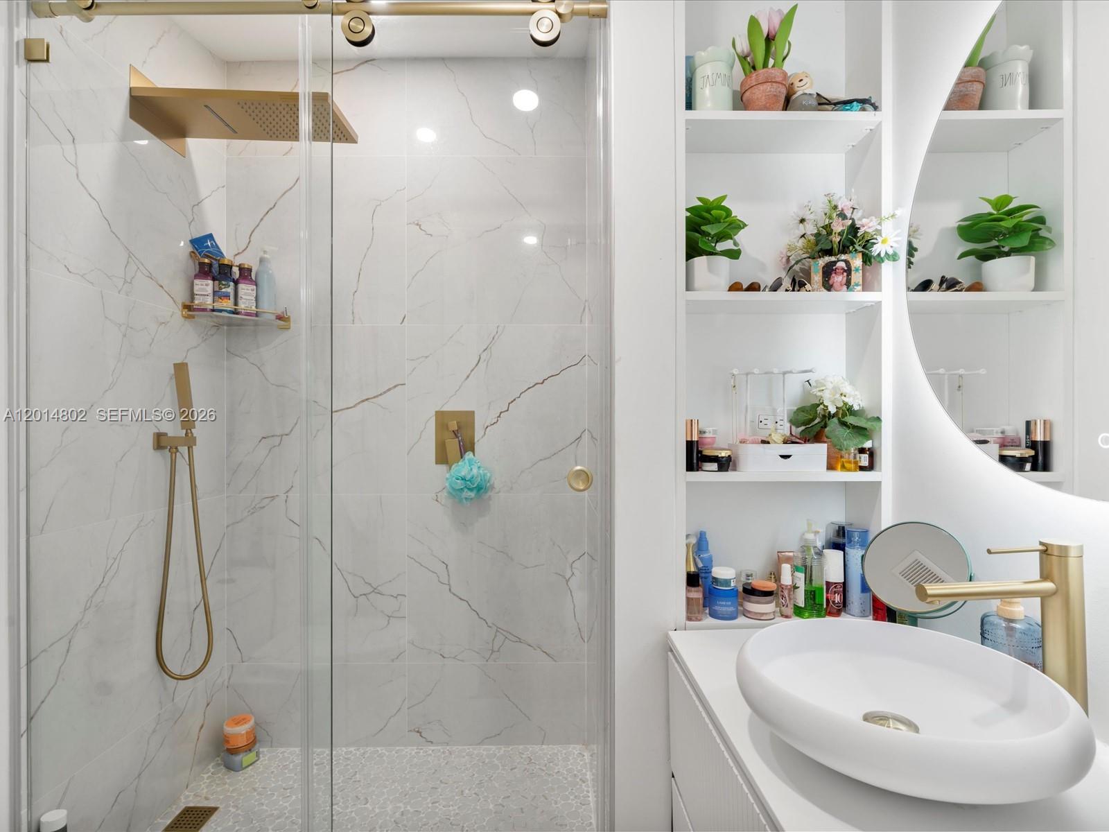 825 Southwest 23rd Road, Unit 1 Miami, FL 33129 - Photo 89 of 92 a bathroom with a sink and a shower