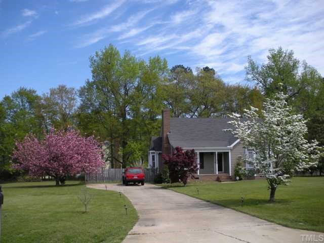 front view of a house with a garden