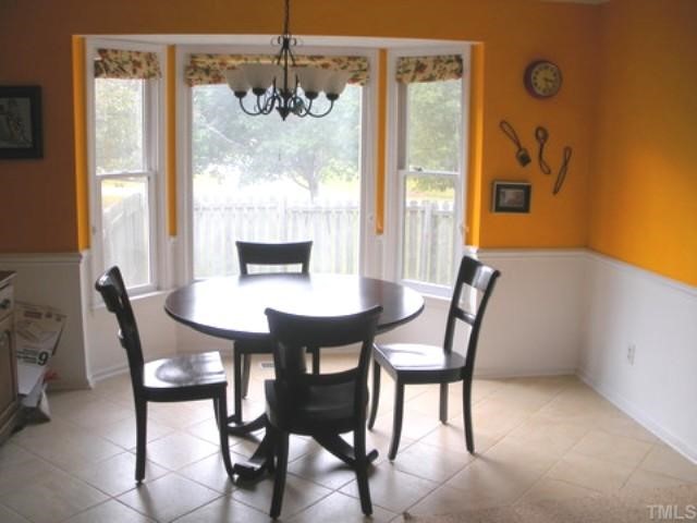 9841 Joe Leach Road Raleigh, NC 27603 - Photo 8 of 11 a dining room with furniture and window