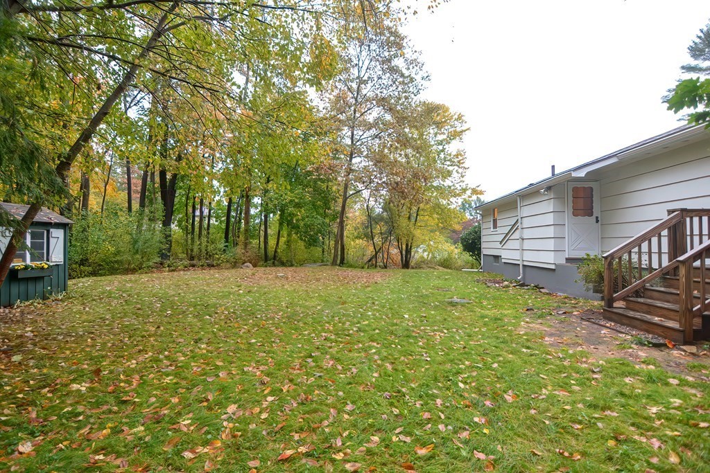 3 Smart Road Acton, MA 01720 - Photo 21 of 23 a backyard of a house with lots of green space