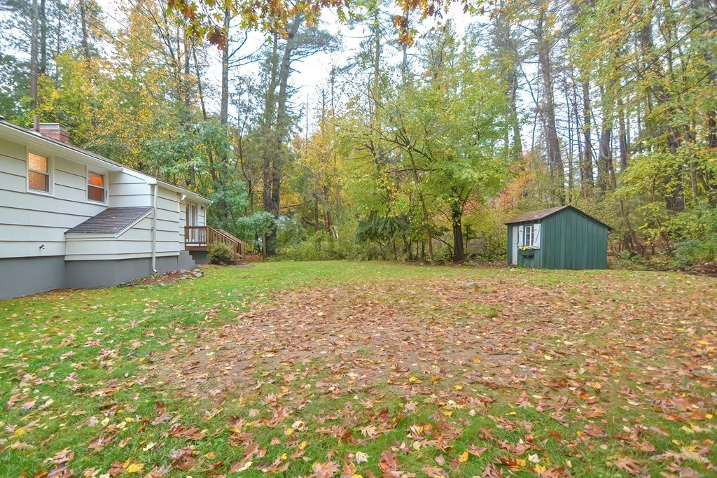 3 Smart Road Acton, MA 01720 - Photo 23 of 23 a backyard of a house with large trees