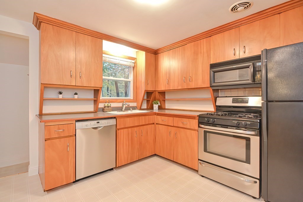 3 Smart Road Acton, MA 01720 - Photo 10 of 23 a kitchen with stainless steel appliances granite countertop a stove a sink and a refrigerator