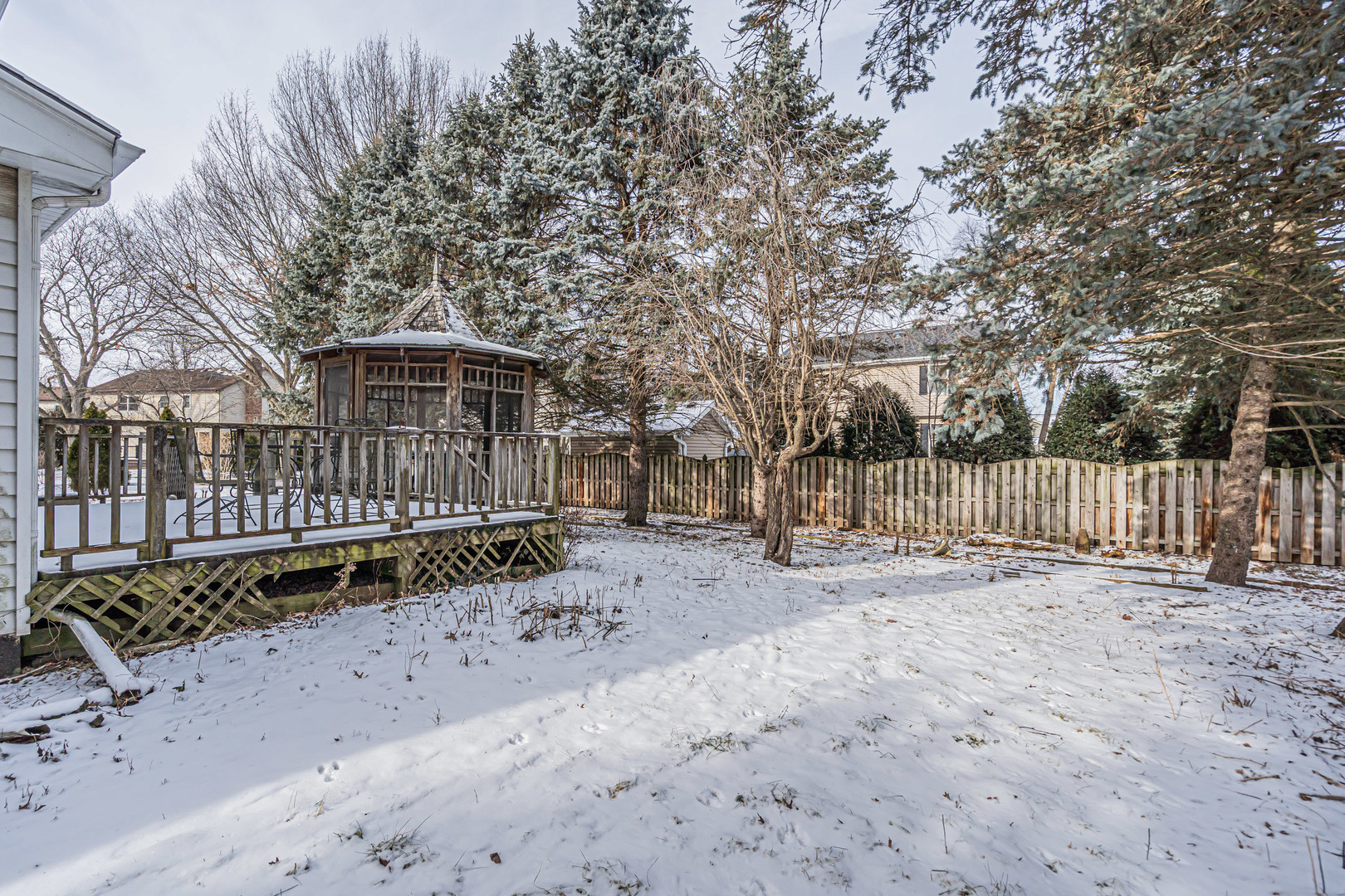 121 South Raddant Road Batavia, IL 60510 - Photo 20 of 22 a view of a yard with wooden fence
