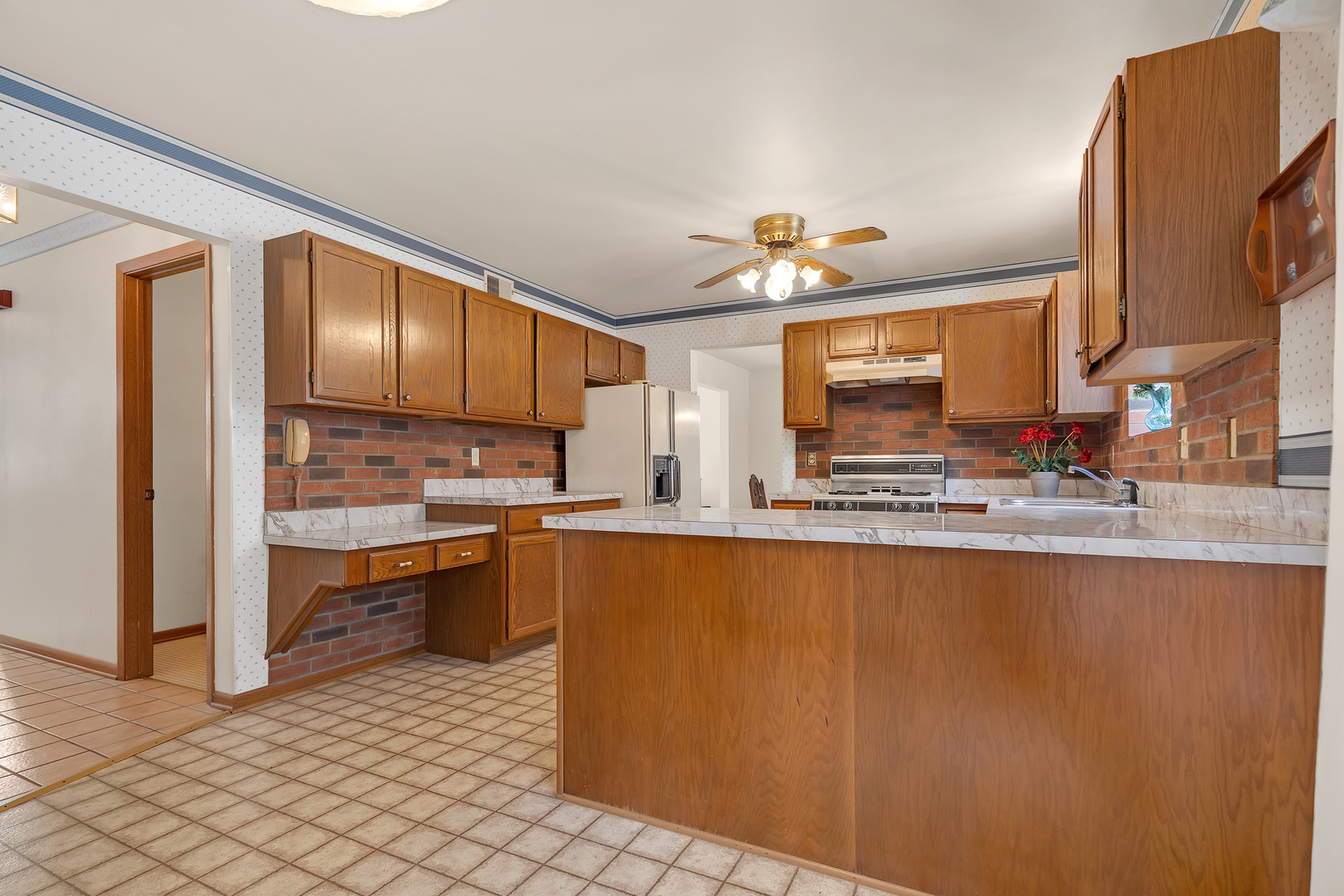 121 South Raddant Road Batavia, IL 60510 - Photo 10 of 22 a kitchen with stainless steel appliances granite countertop a granite counter tops and a view of living room