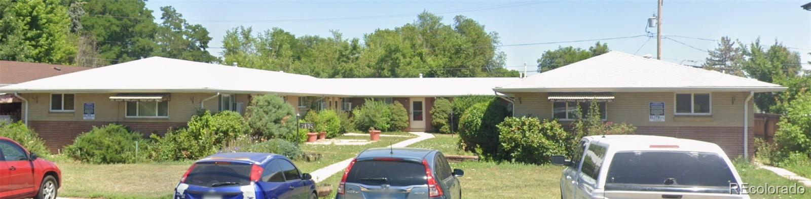 a view of a patio with table and chairs potted plants