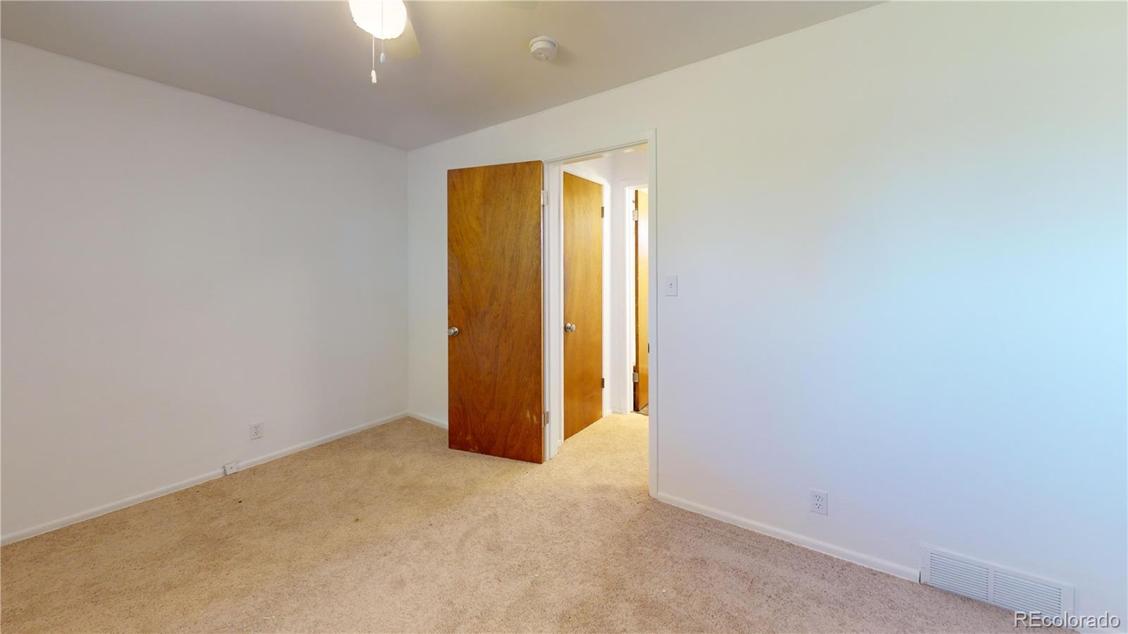 7805 West 41st Avenue, Unit 4 Wheat Ridge, CO 80033 - Photo 5 of 17 an empty room with window