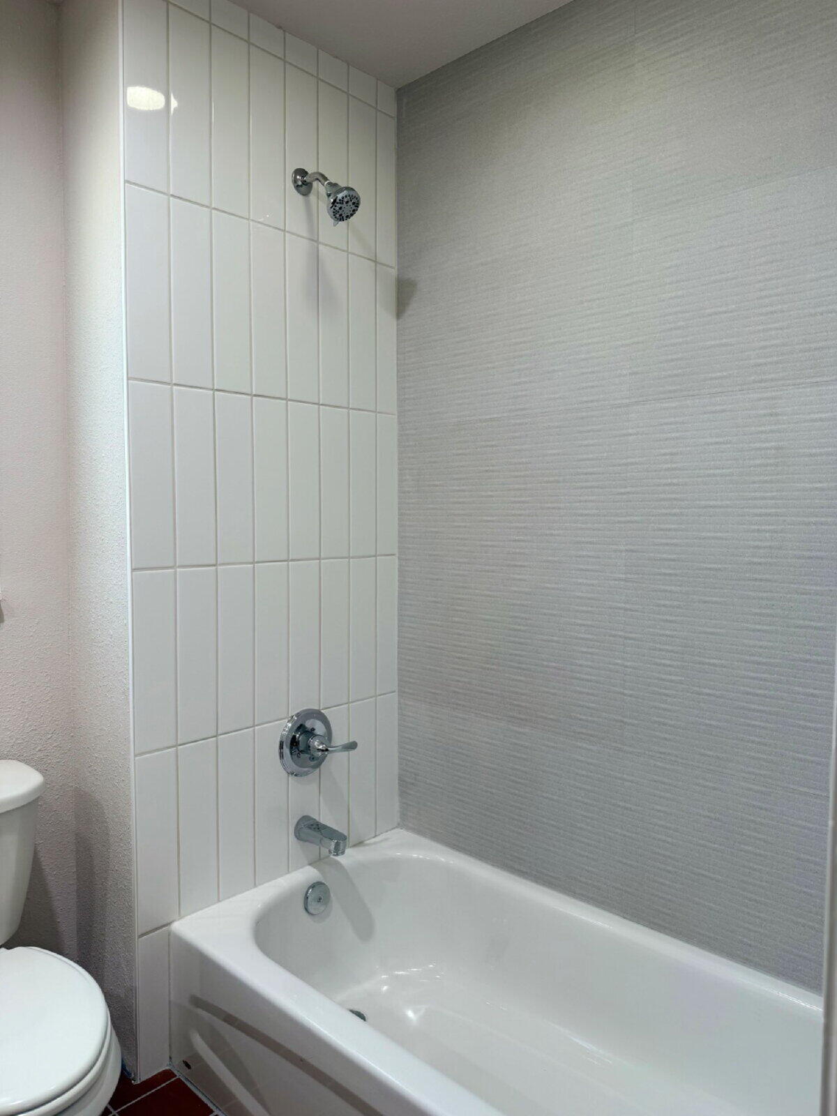 3118 37th Street, Unit B Lubbock, TX 79413 - Photo 13 of 21 a bathroom with a sink a toilet and shower