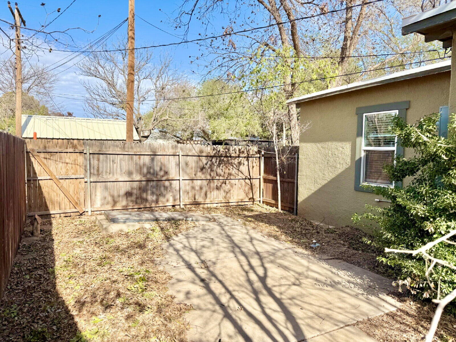 3118 37th Street, Unit B Lubbock, TX 79413 - Photo 21 of 21 a front view of a house with a yard