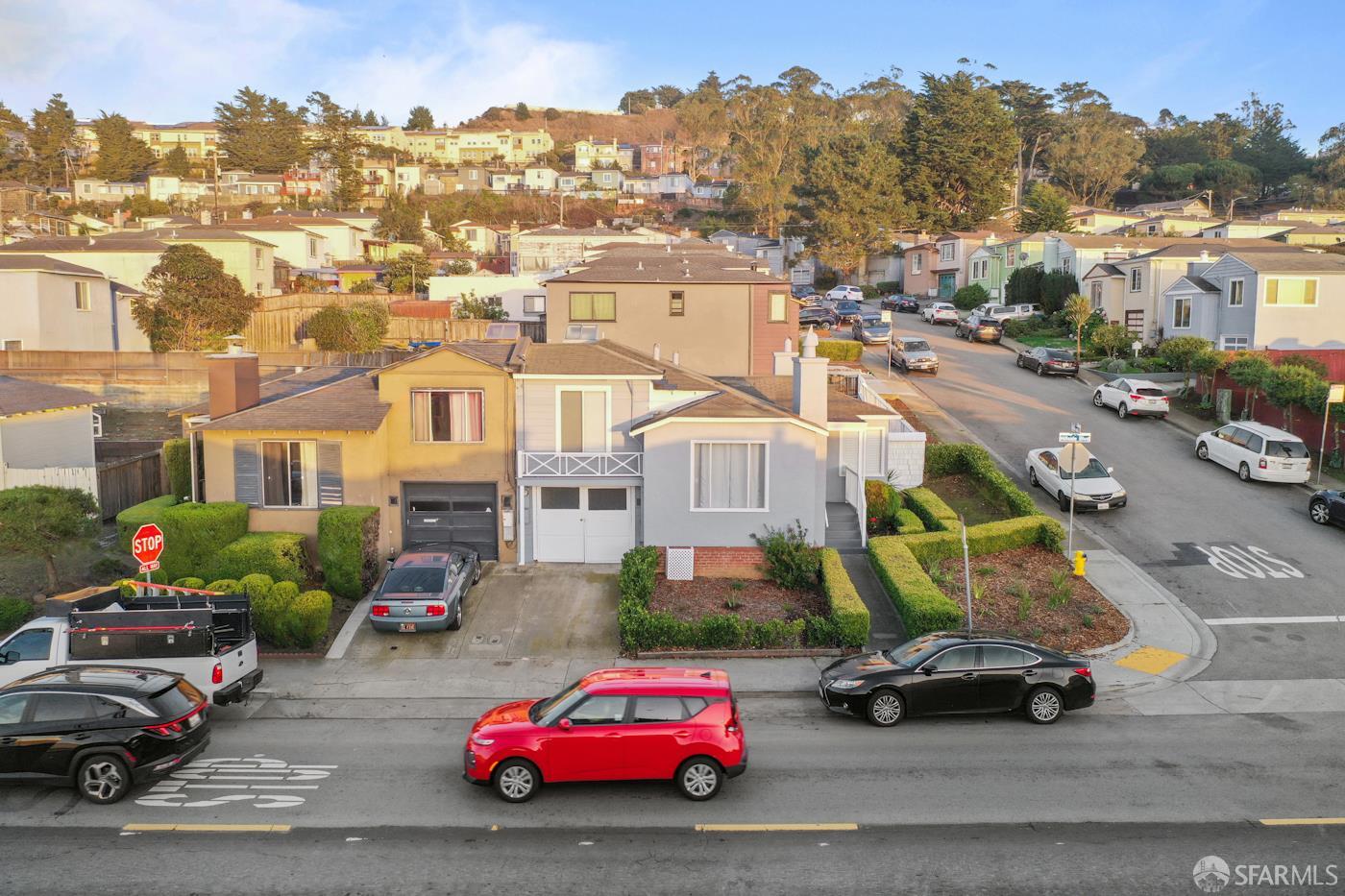 193 Hillside Boulevard Daly City, CA 94014 - Photo 1 of 20 a city street with cars parked in front of it