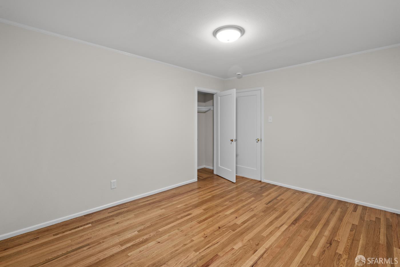 193 Hillside Boulevard Daly City, CA 94014 - Photo 13 of 20 a view of room with wooden floor