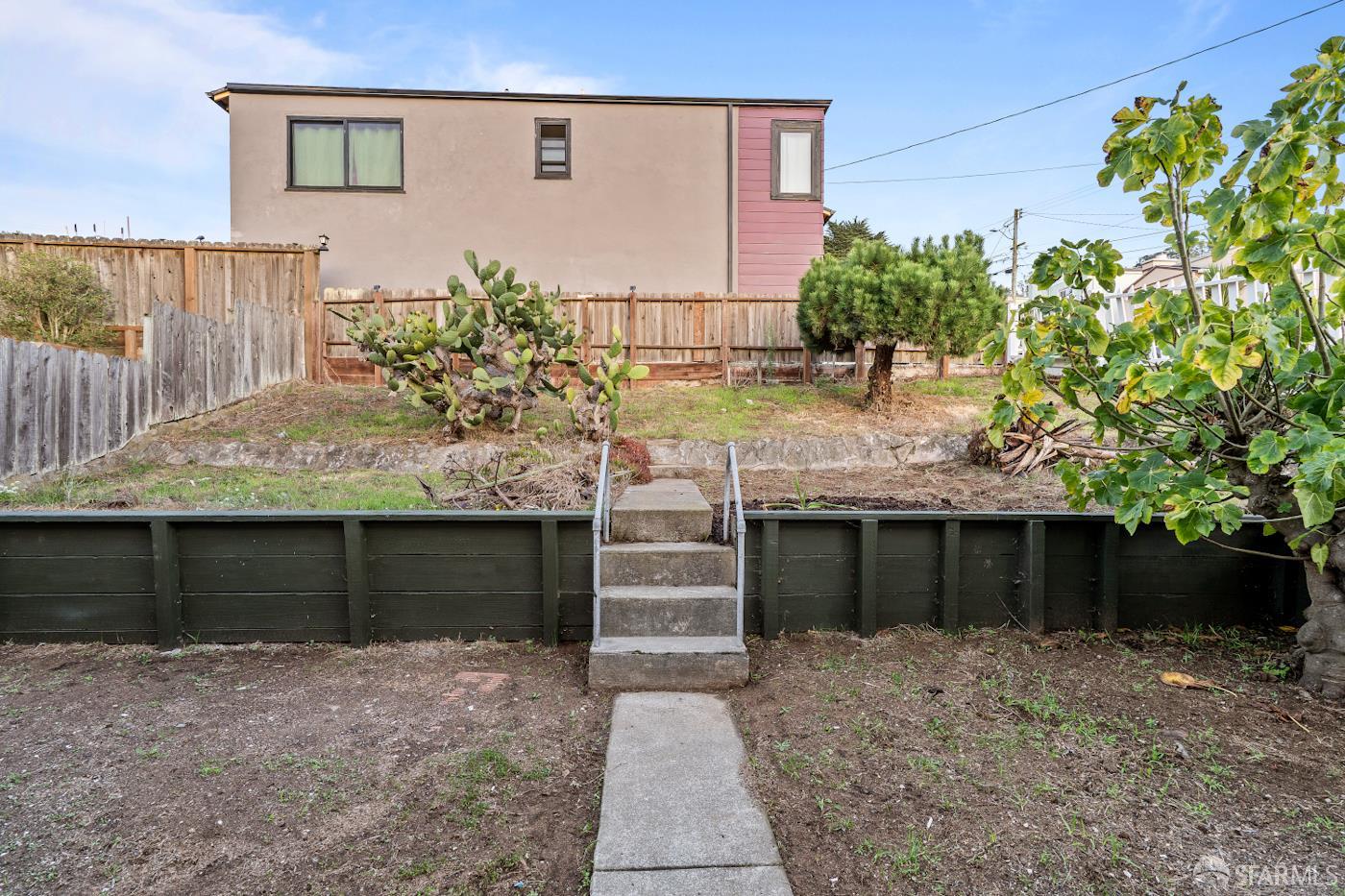 193 Hillside Boulevard Daly City, CA 94014 - Photo 17 of 20 a front view of a house with a yard and garage