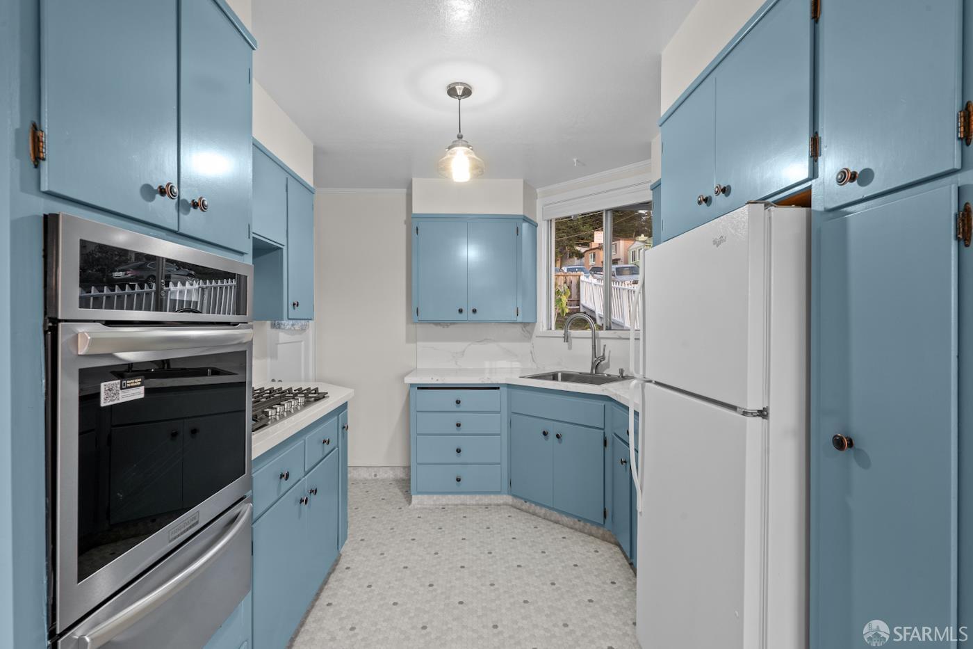 193 Hillside Boulevard Daly City, CA 94014 - Photo 7 of 20 a kitchen with granite countertop a refrigerator a sink a stove and a refrigerator