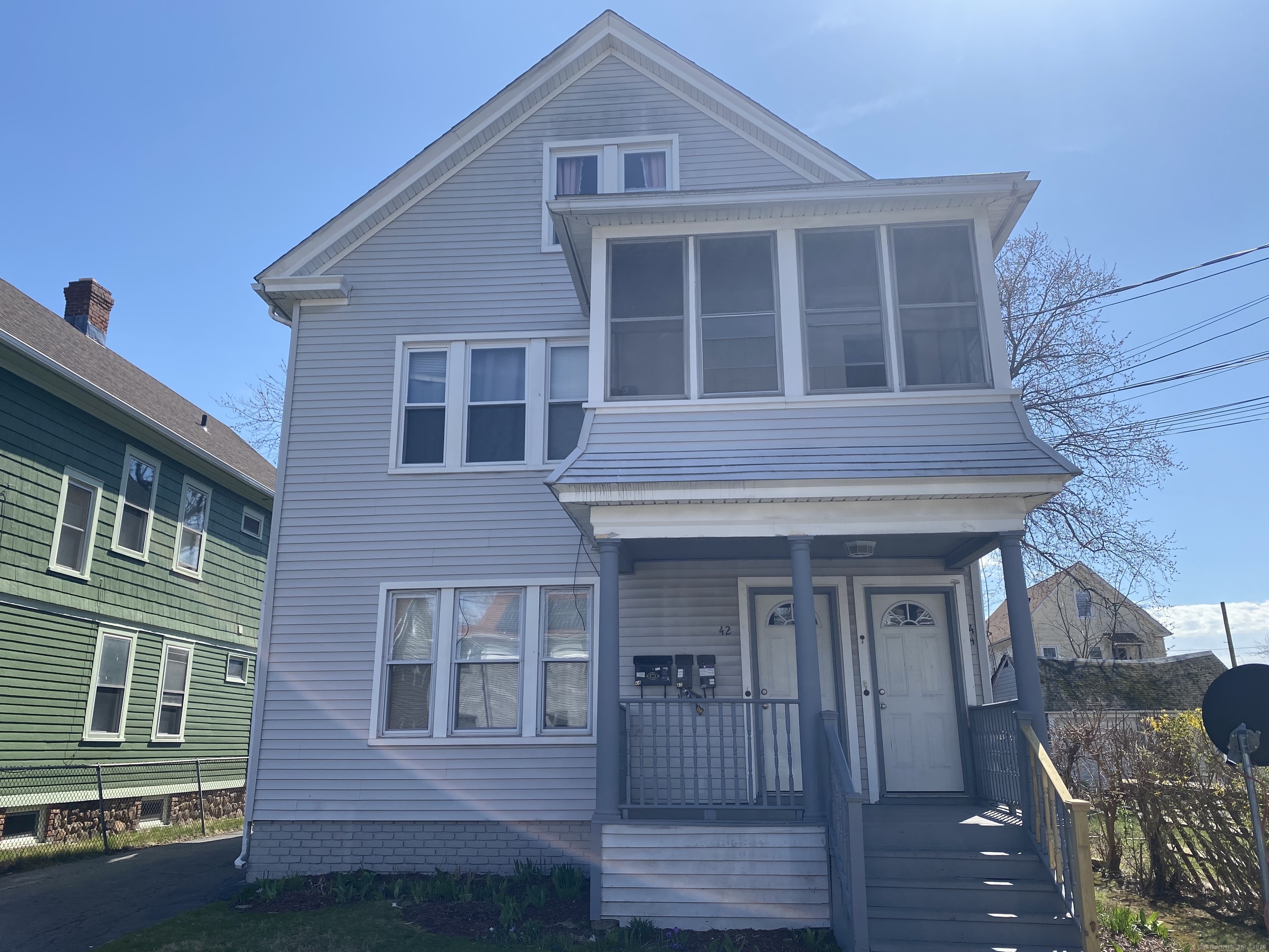 42 Collins Street Hamden, CT 06514 - Photo 1 of 1 a front view of a house with a yard