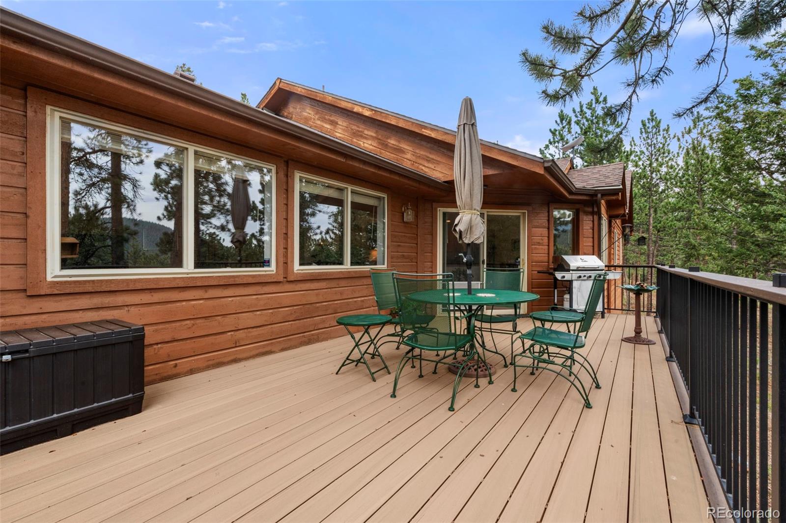 84 Marys Lane Bailey, CO 80421 - Photo 26 of 35 a view of a house with sitting area and wooden chairs