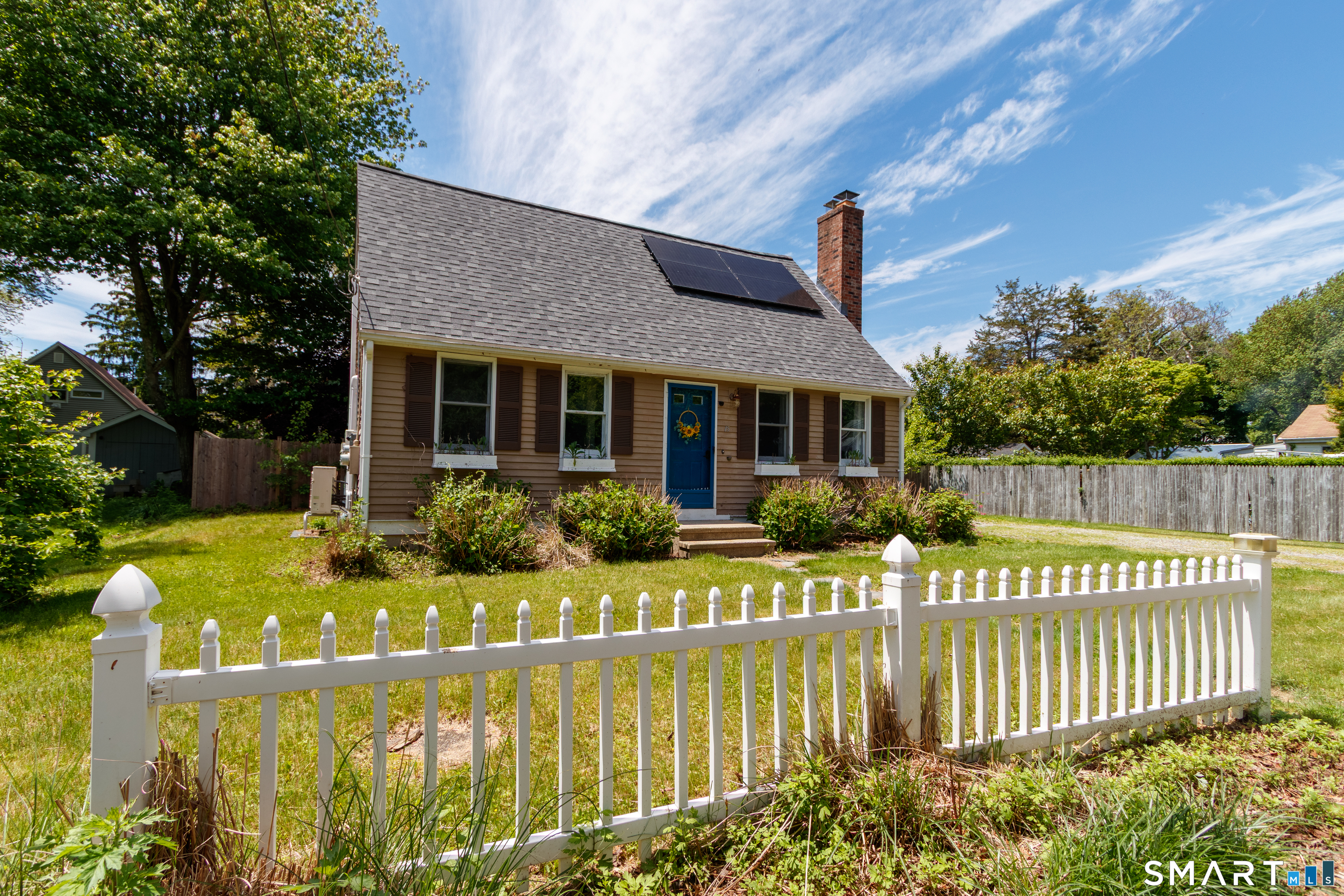 15 Bluff Avenue Clinton, CT 06413 - Photo 5 of 38 a front view of house with yard seating and green space