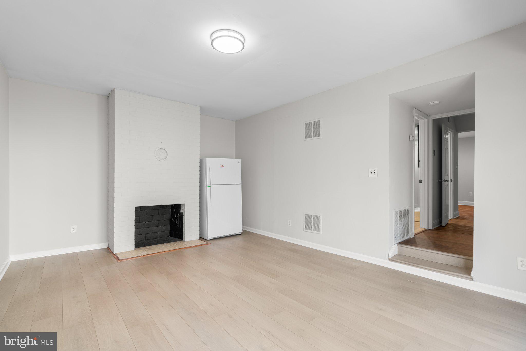 8583 Seasons Way Lanham, MD 20706 - Photo 11 of 25 an empty room with fireplace