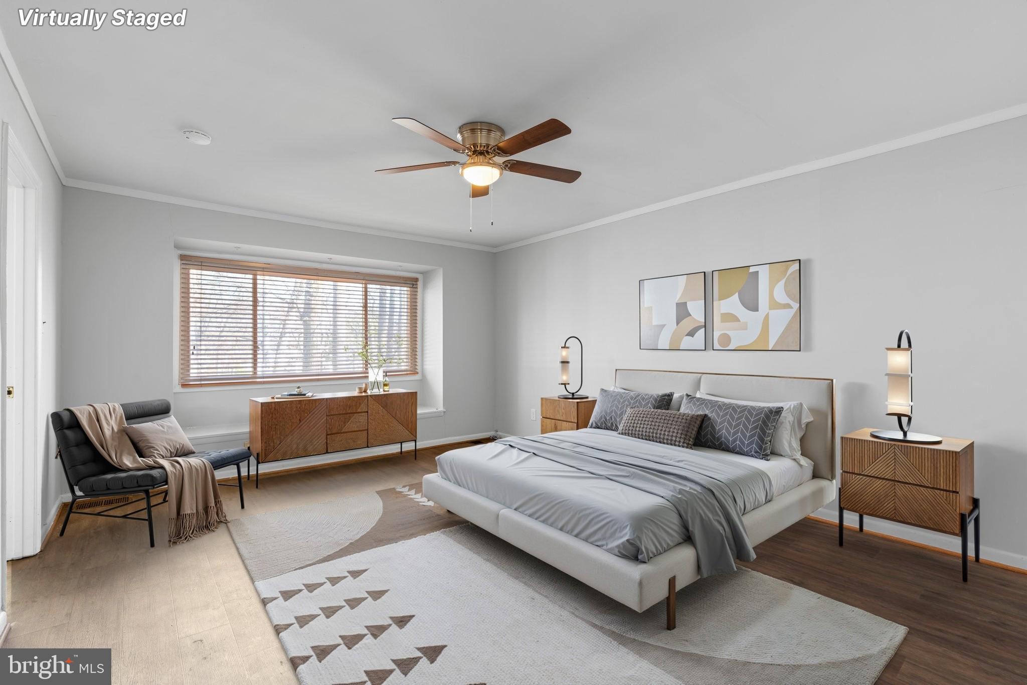 8583 Seasons Way Lanham, MD 20706 - Photo 16 of 25 a bedroom with a bed a couch and a window
