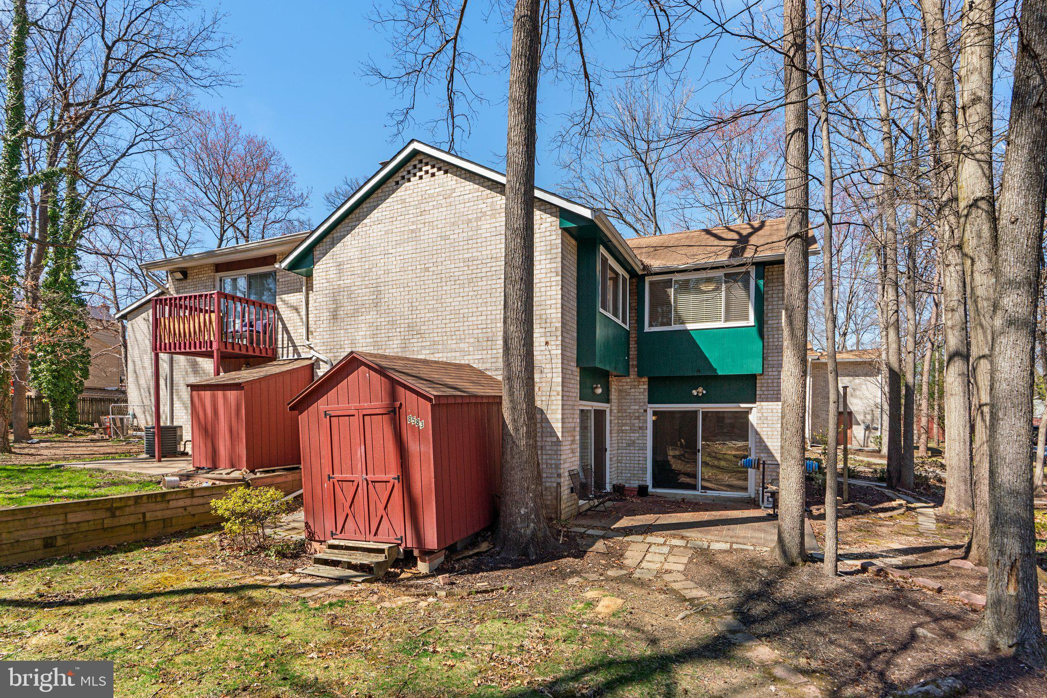 8583 Seasons Way Lanham, MD 20706 - Photo 21 of 25 a view of a house with a yard and wooden fence